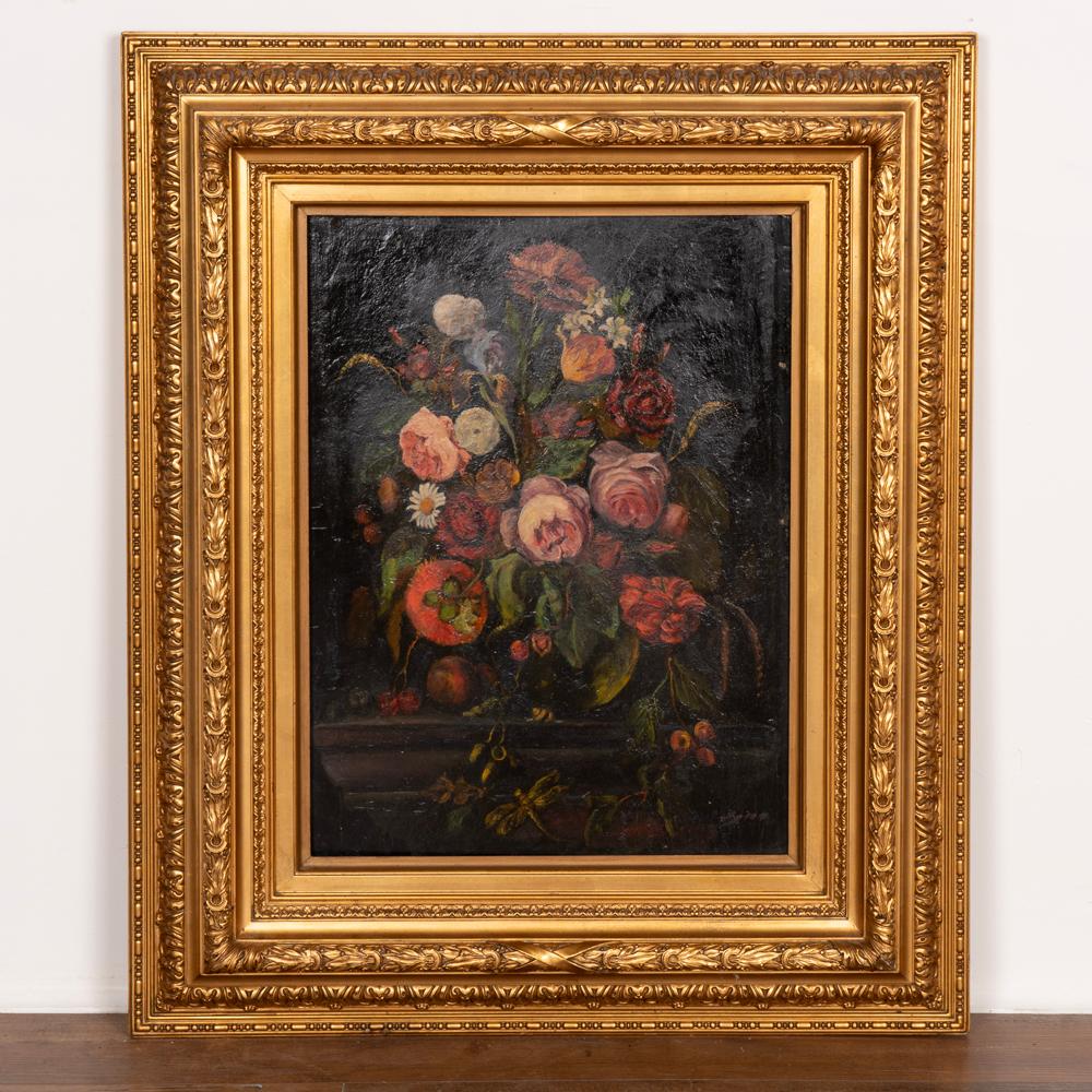 Original oil on board still life painting, bouquet of flowers with vibrant colors, small fruit and dragonfly. 
Signed lower right, unknown artist.
Sold in original vintage condition, minor crack in lower left corner, cracquleur, etc.
Please refer