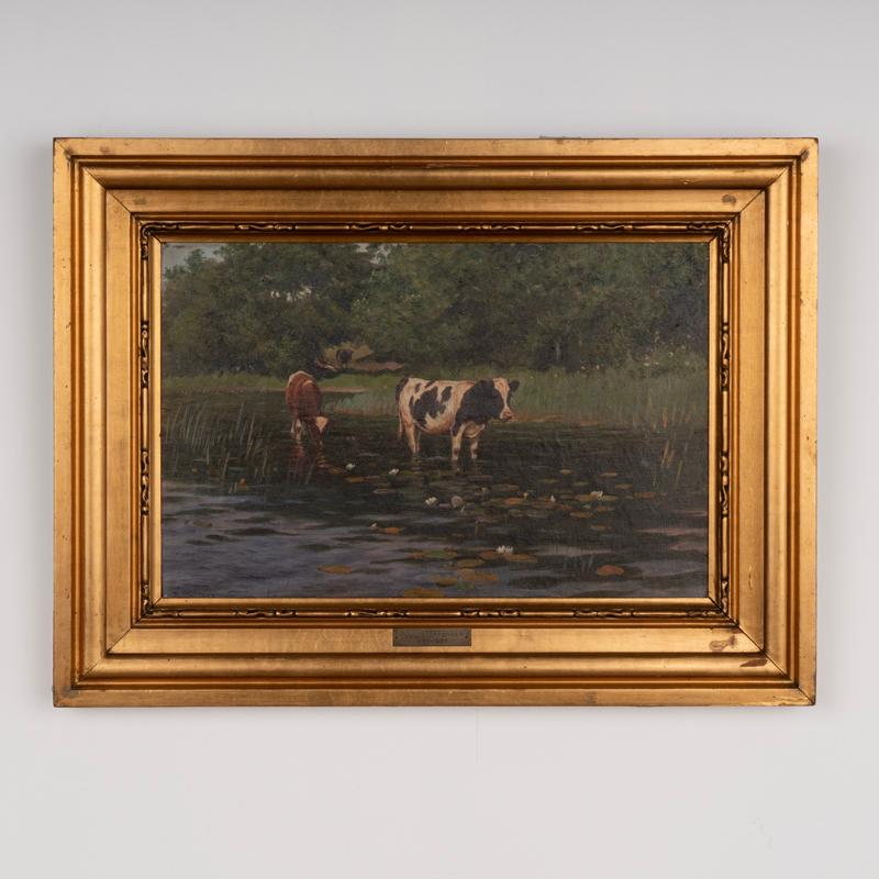 Original oil on canvas landscape with two cows in pond with lilly pads.
Signed and dated P. St. 1912. 
Artist: Poul Steffensen (b. Bjerringbro 1866, d. Aarhus 1923)
Condition:Canvas will benefit from light surface cleaning. Some minor scuffs