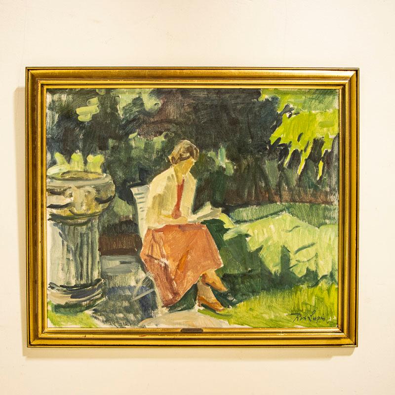 Lovely oil on canvas portrayal of a woman enjoying a summer day. This scene is a typical Danish garden with woman in red reading in a garden chair. Signed in the lower right corner by artist Robert Leepin (1885 - 1967). Mr. Leepin was a Latvian