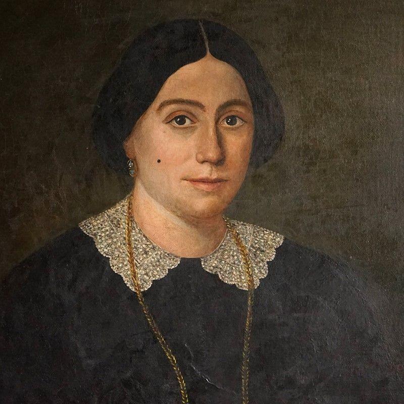 Antique Original Oil on Canvas Painting Depicting a Female Sitter
 
There is something about this portrait that really drew me to it. I love the almost naive style that it has been painted in with little details like the beauty spot, lace collar and