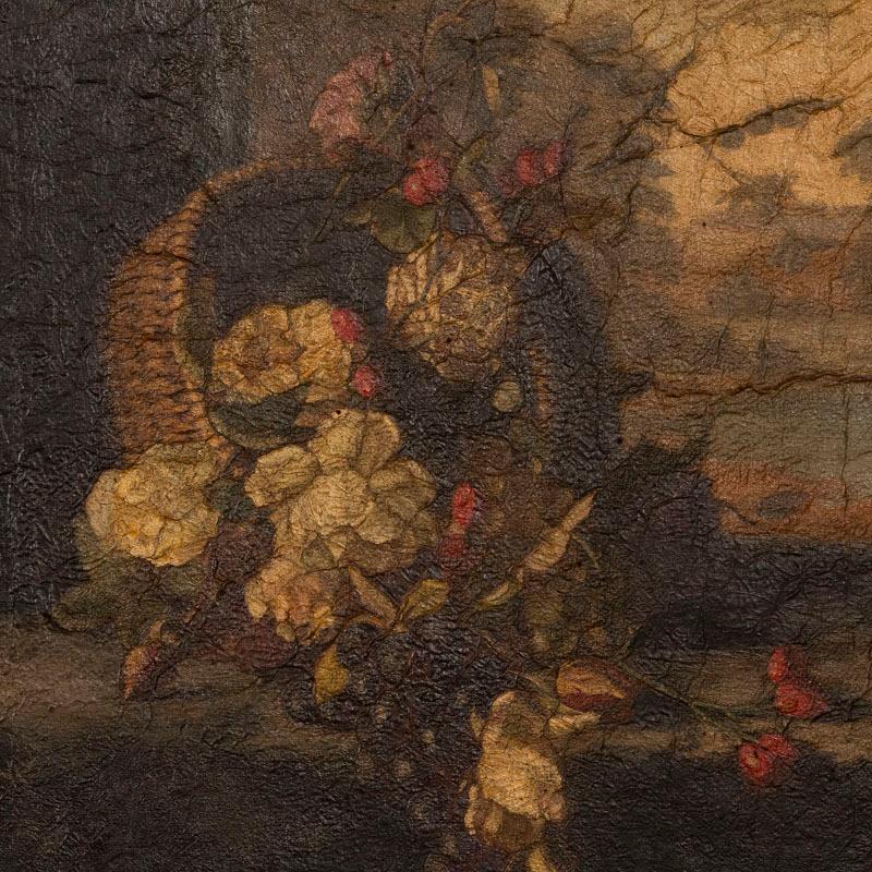 Unsigned still life oil on canvas of flowers and fruits in a basket from the mid-late 1800s. The basket appears to rest in a curved windowsill, with view of picturesque landscape in the distance. The thick paint reveals craquelure throughout the