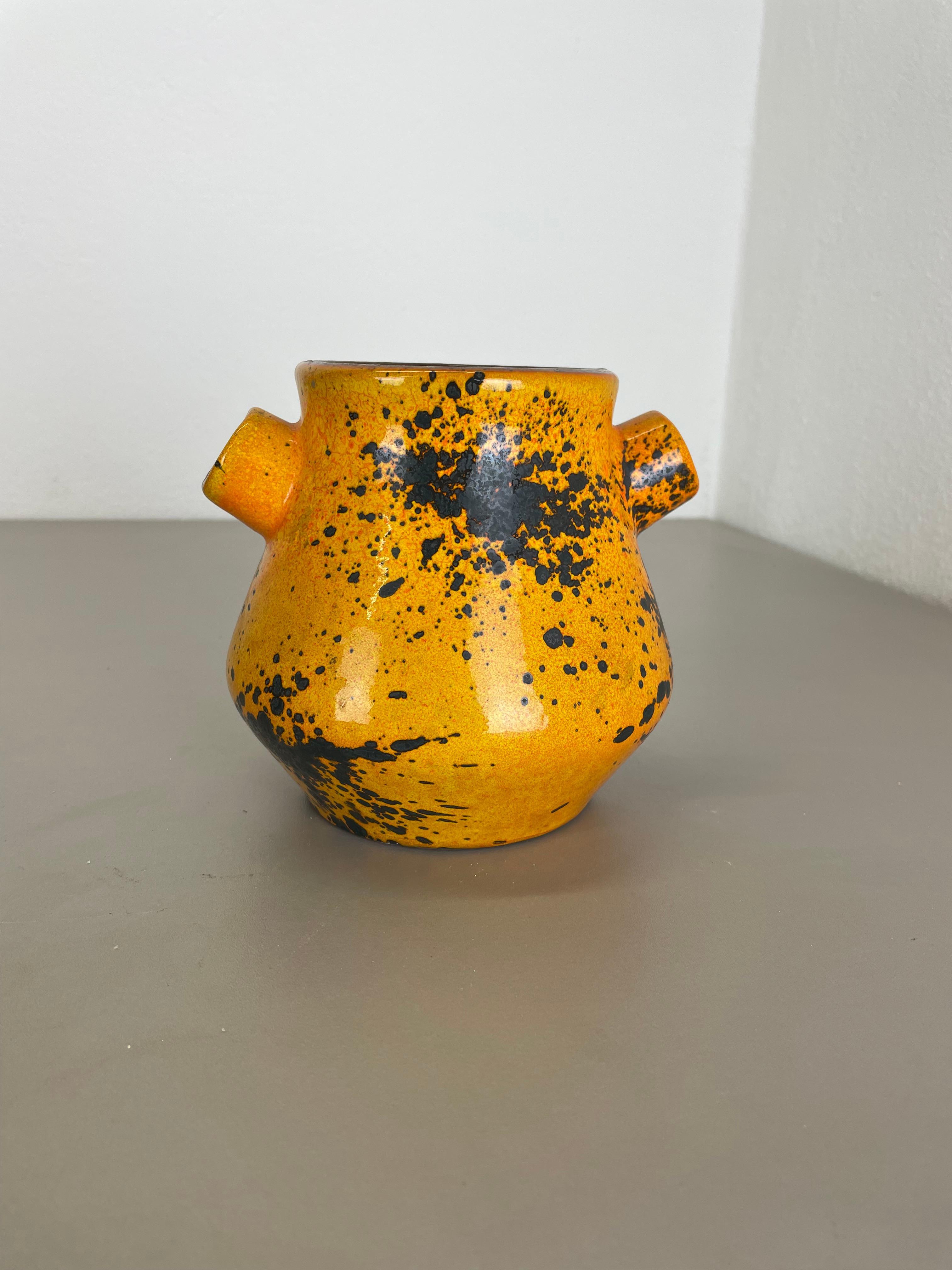 Article:

Ceramic fat lava 


Producer:

Marei Ceramics, Germany


Decade:

1970s



Original vintage Studio Pottery vase was produced in the 1970s by Marei Ceramics, Germany. The vase is made of pottery with a very nice orange glaze tone, and
