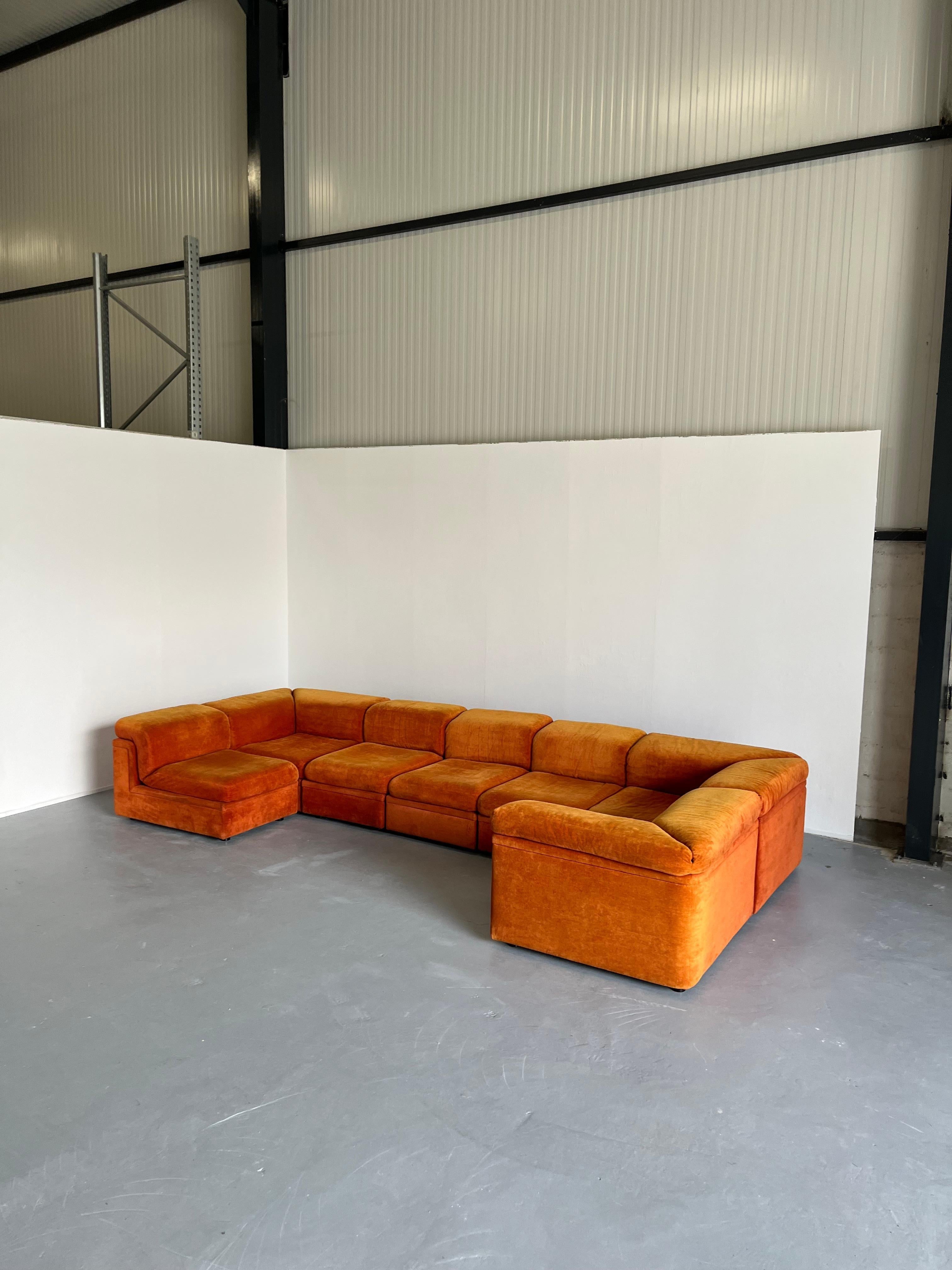 A stunning seven-part Mid-Century-Modern sectional sofa attributed to Friedrich Hill and produced by Knoll Collections during the early 1970s.

Large and stunning, the piece is not only a
The vintage orange velvet upholstery is 

'Knoll