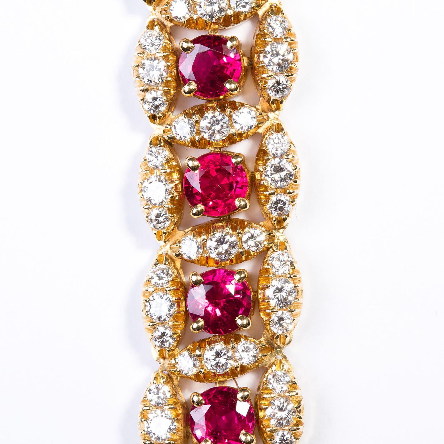 Beautiful Original Oscar Heyman ruby and diamond bracelet circa 1980s crafted in 18k yellow gold. This unique and beautifully crafted bracelet showcases 22 crimson red ruby’s weighing approximately 12.1 carats total surrounded by 198 round brilliant
