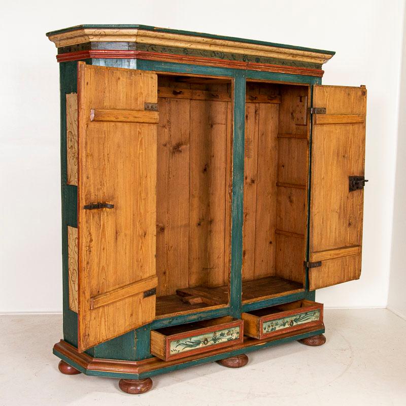 This remarkable armoire has exceptional original paint and is dated 1774 with a monogram of 