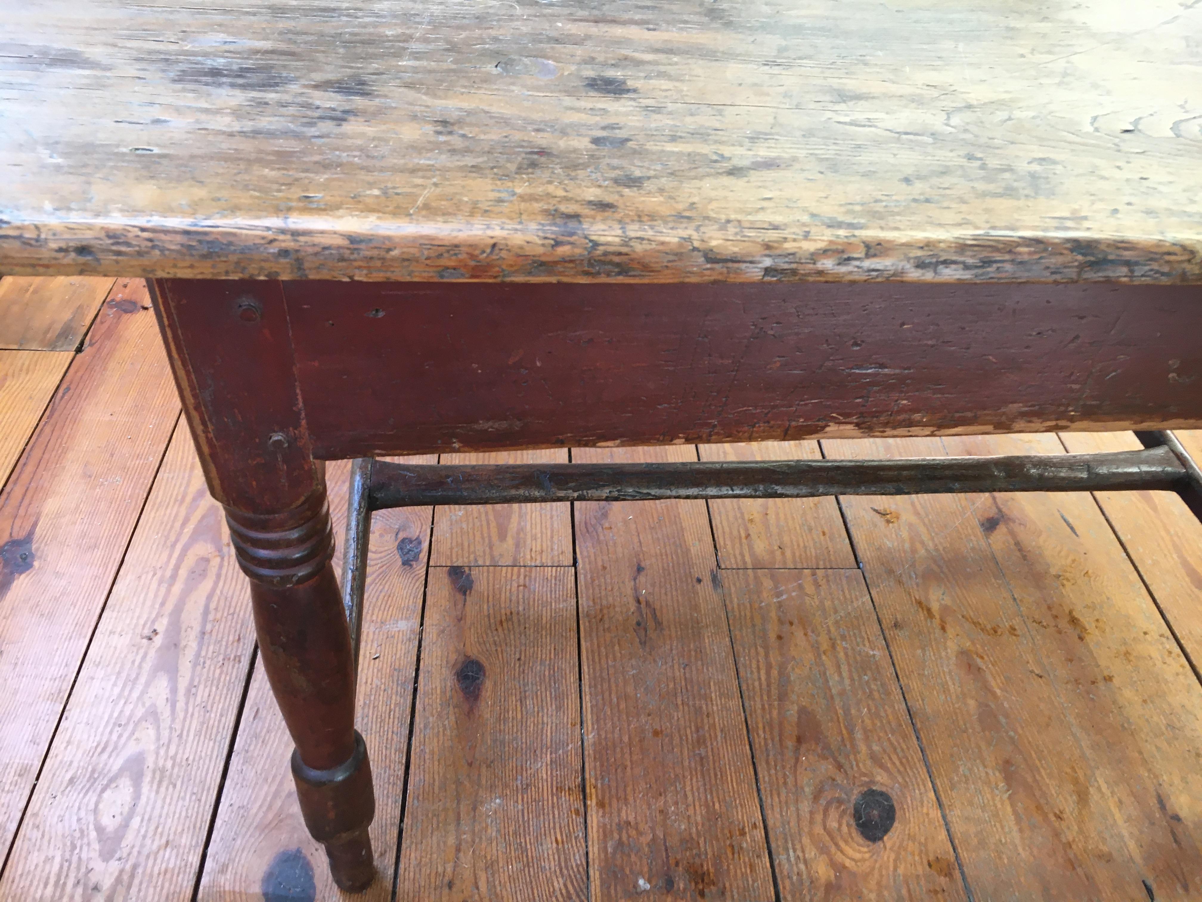 - Finding a table with original paint is a real joy. Old worn red paint on the base and two boards on the top with turned legs make this table a real find. It would make a cozy perfect breakfast table or even use it as a large end table.