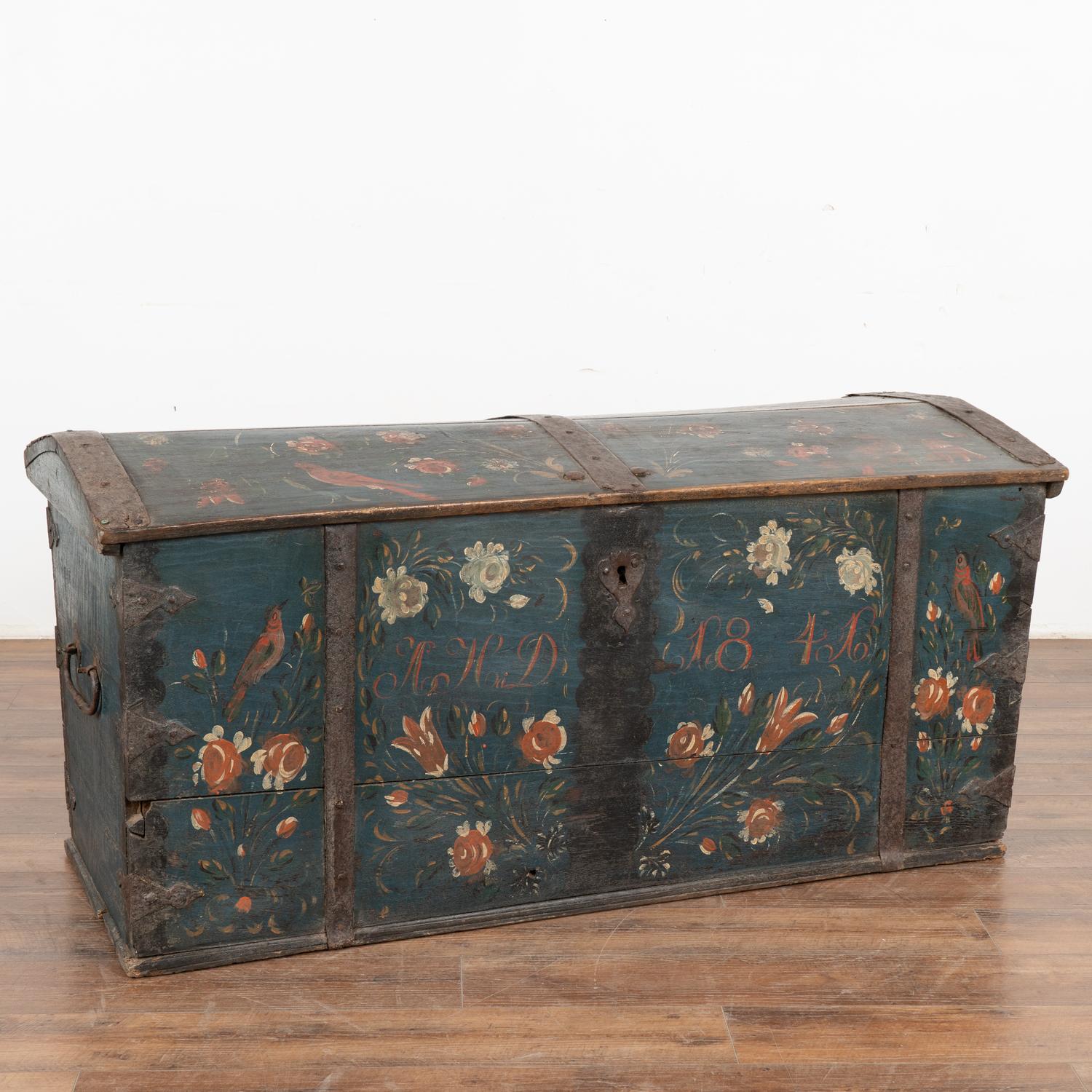 Original blue painted dome top oak trunk from Sweden with traditional hand-painted details including beautiful bird and floral motif along top and front.
Monogram of AHD and date 