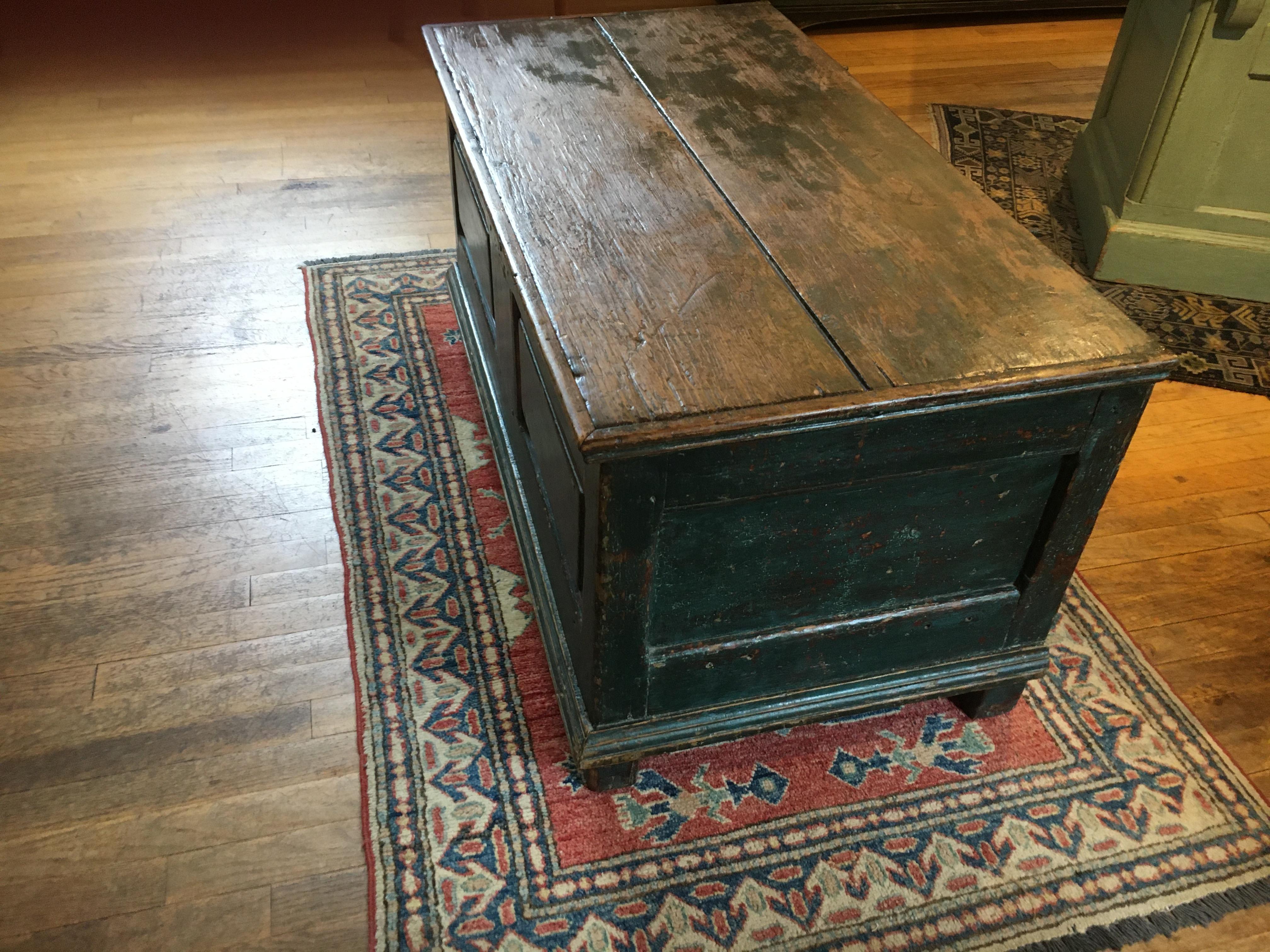 Pine, circa 1800, original paint is so hard to find but we did it with this blue, green blanket chest. It has forged nails and raised panels and is gorgeous! This could go at the end of a bed or be used as a coffee table. The height is perfect.