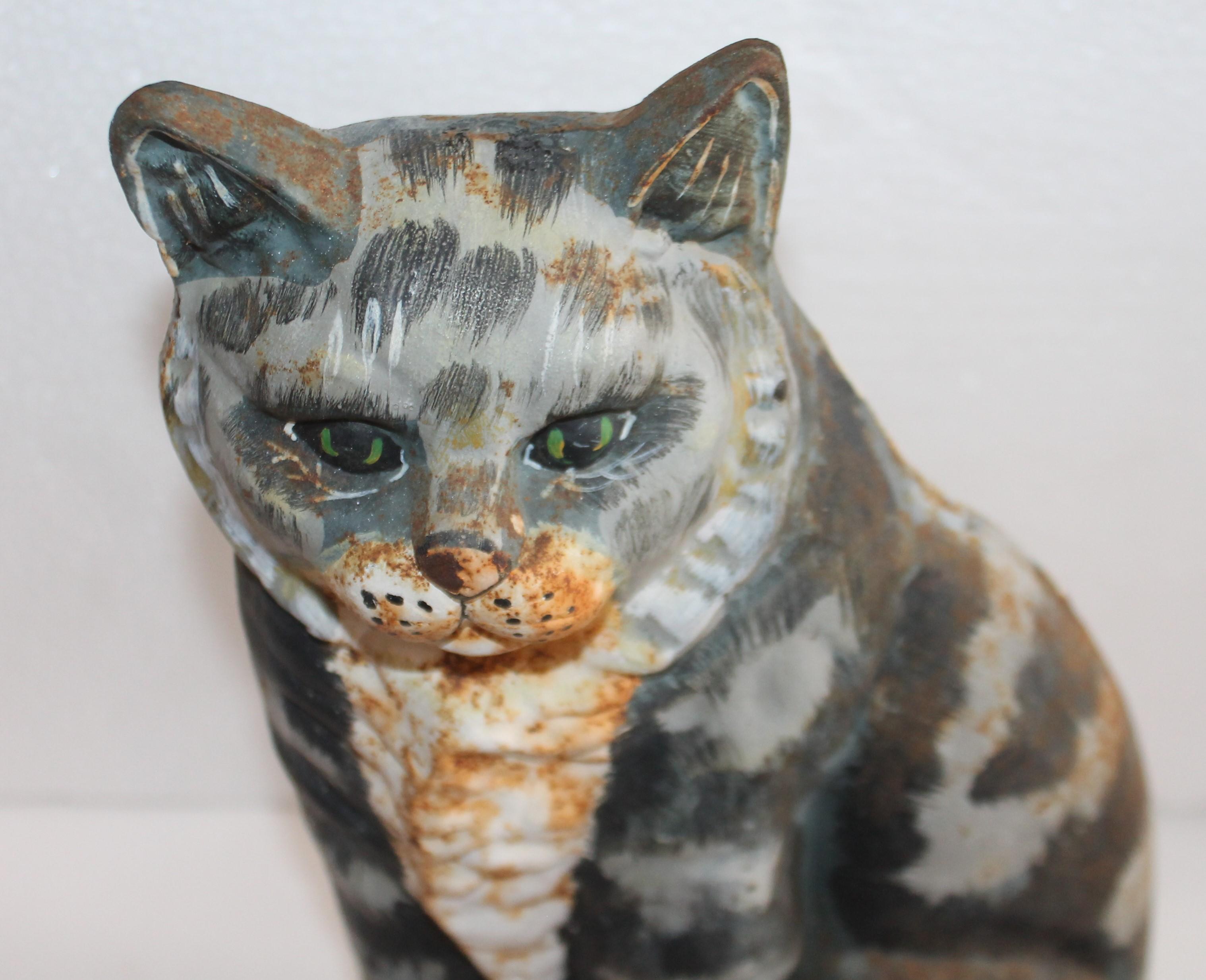This fun original hand painted iron cat door stop. There is minor rust but nice patina.