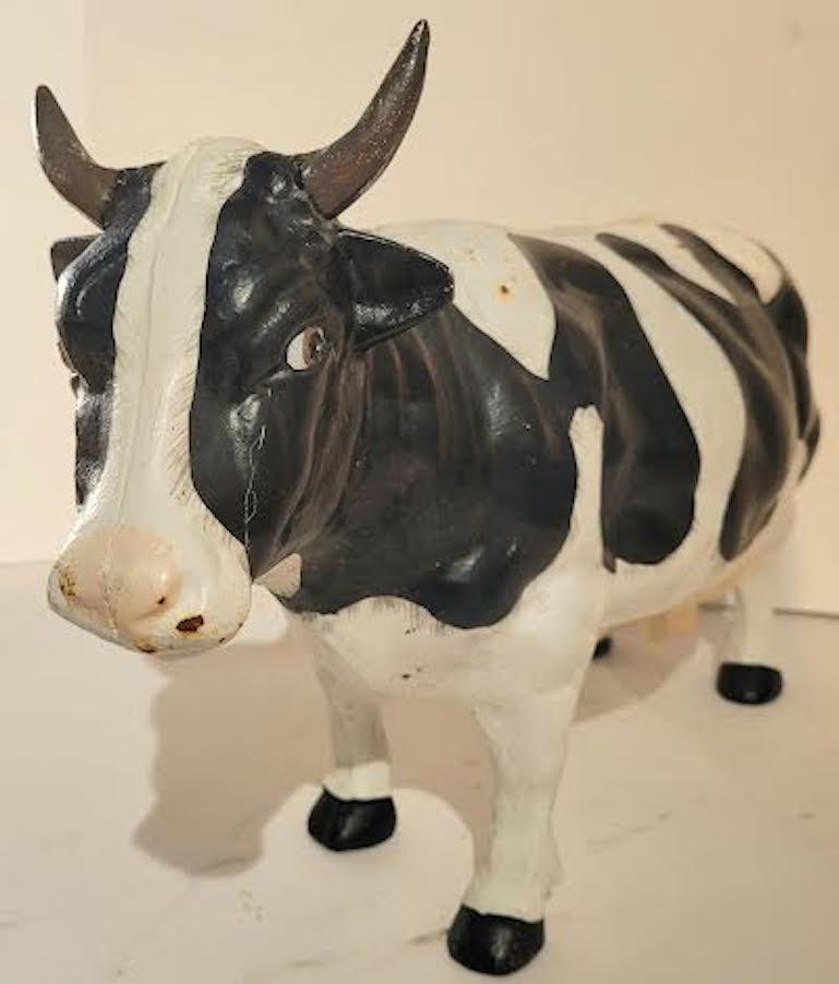 Extremely heavy original painted cast iron cow.