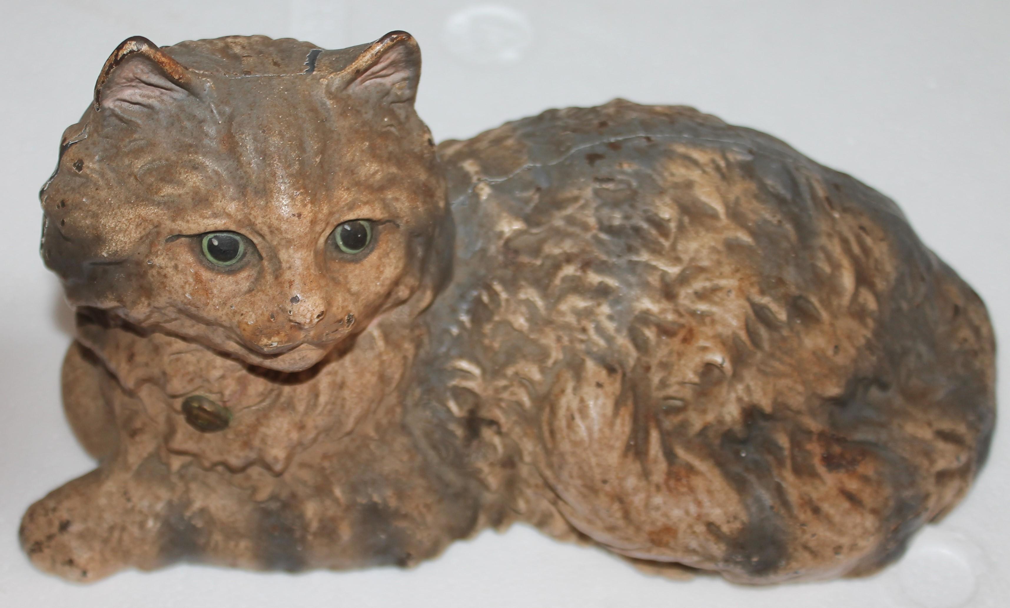 This early and original painted signed Hubley cast iron cat door stop. The painted surface is the very best.