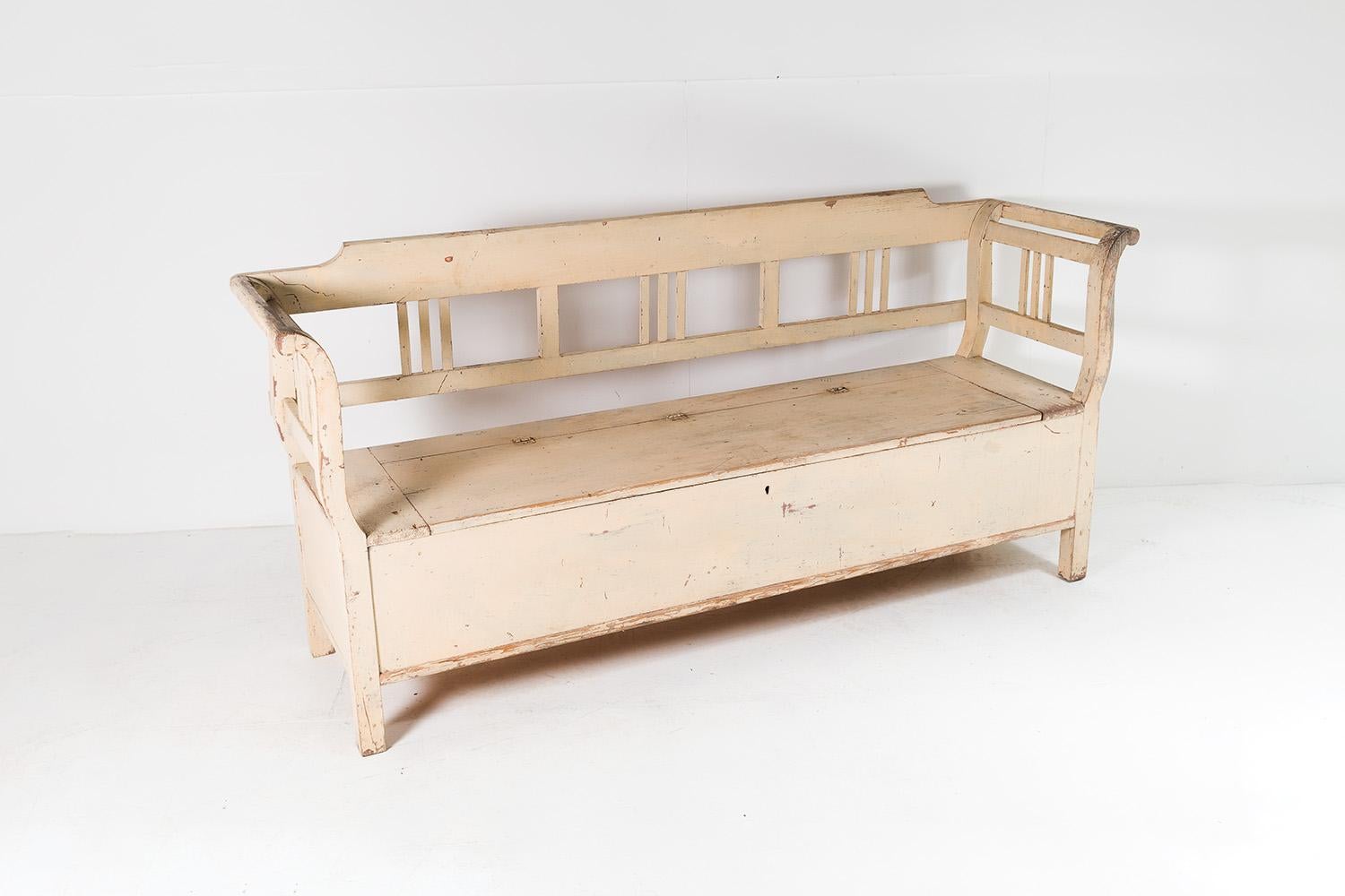 A lovely old European box settle in original cream paint. An early example made from solid pine, probably an old farmhouse or Shepherds bench with lift up lid for storage.
In it’s original rustic paint, it boasts a wonderful worn look with the old