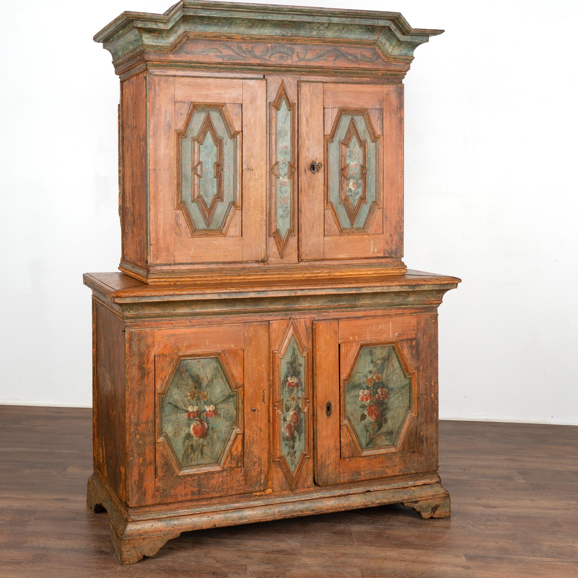 This cabinet is a remarkable example of Swedish country craftsmanship and original folk art painting. The deep patina of the pine is a result of many generations of use and age.
The exquisite hand-painted blue panels are embellished with delicate