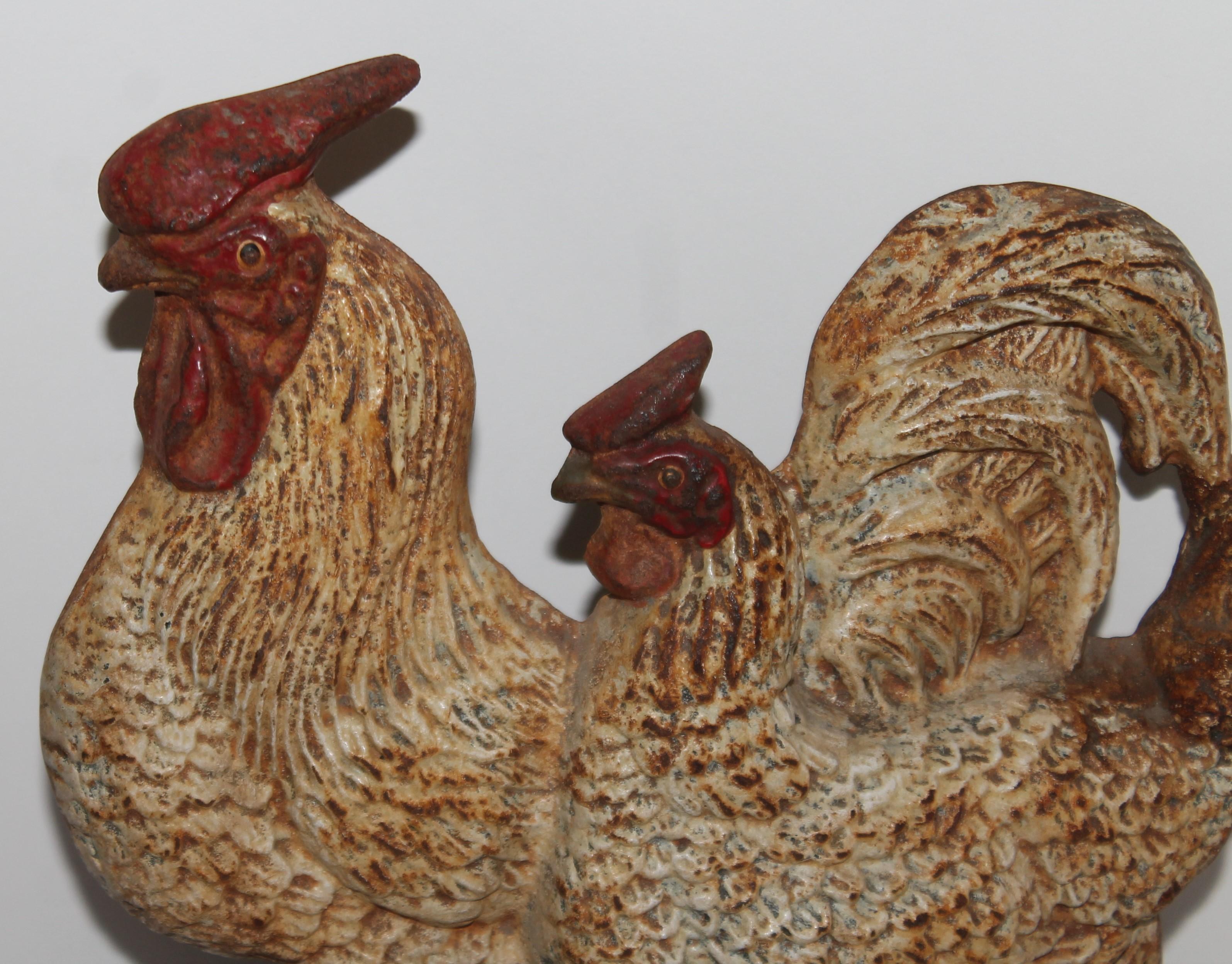 This folky original painted double roosters cast iron door stop. Fantastic patina and undisturbed surface.