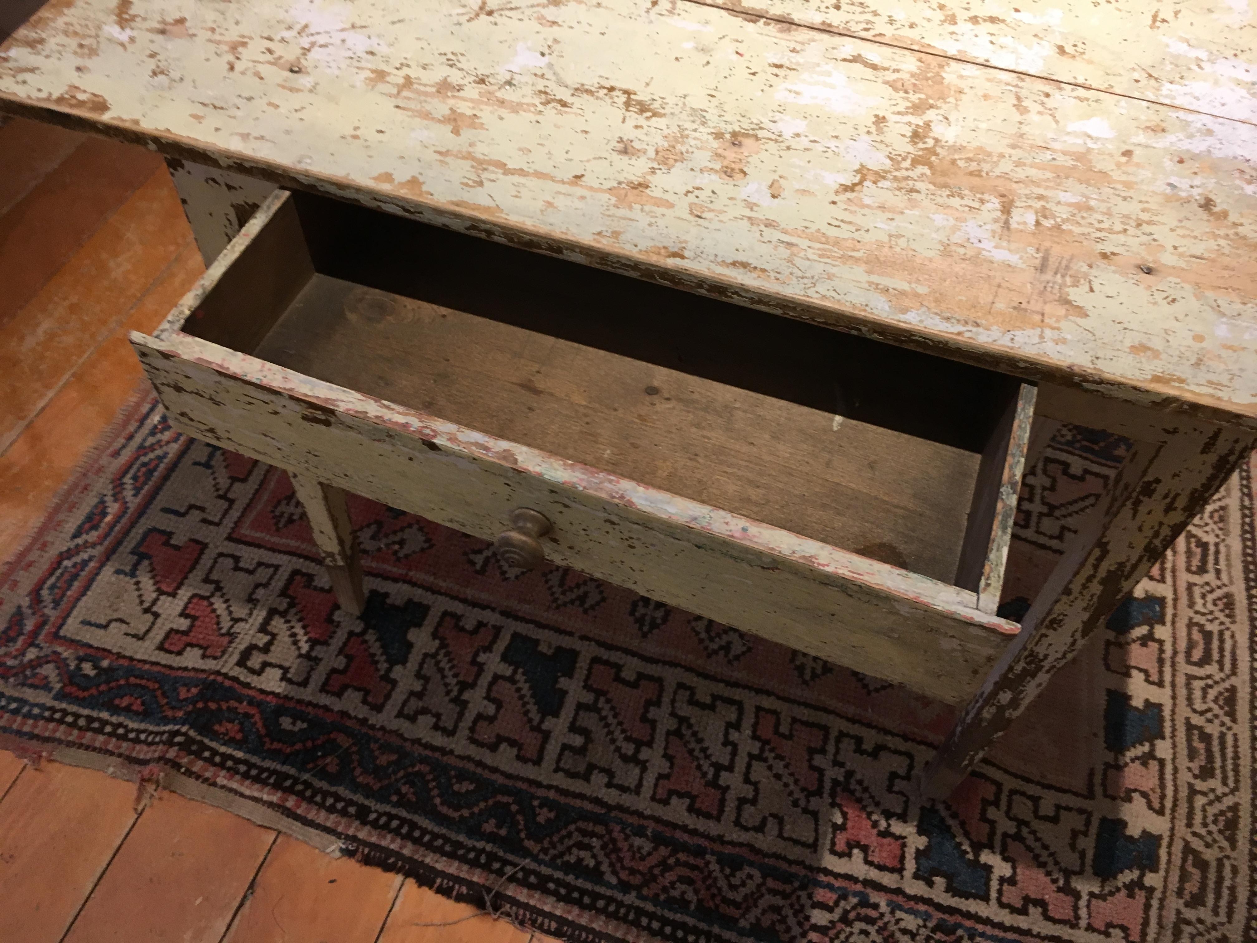 This is a very sweet small end table with original off-white paint and one drawer. Is it appropriately worn for its age and a wonderfully-priced piece.