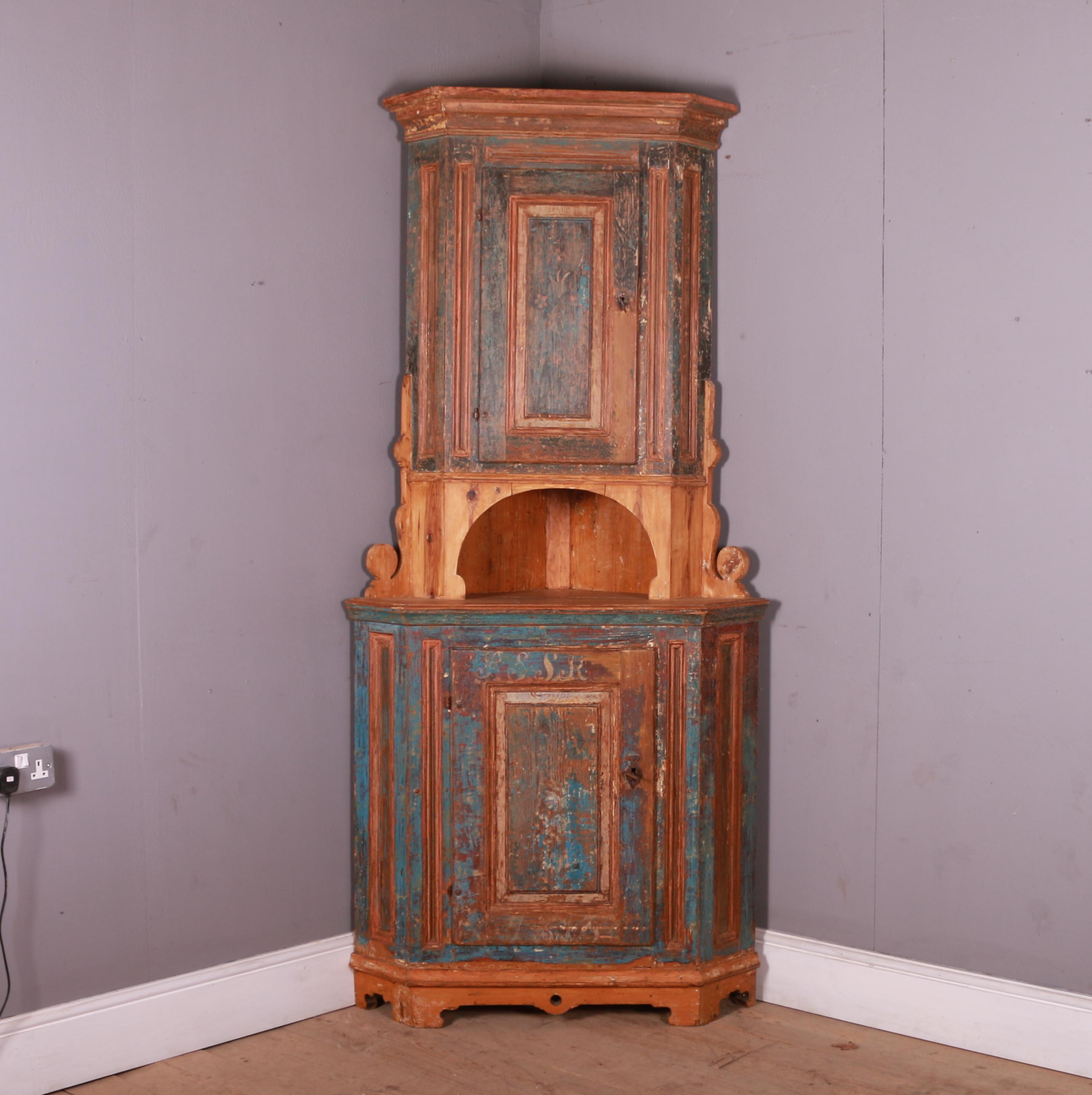 Wonderful early 19th C original painted Swedish one piece corner cupboard. This has been hand scraped back to the original paint finish. dated 1813.

This cupboard will fit into a 27