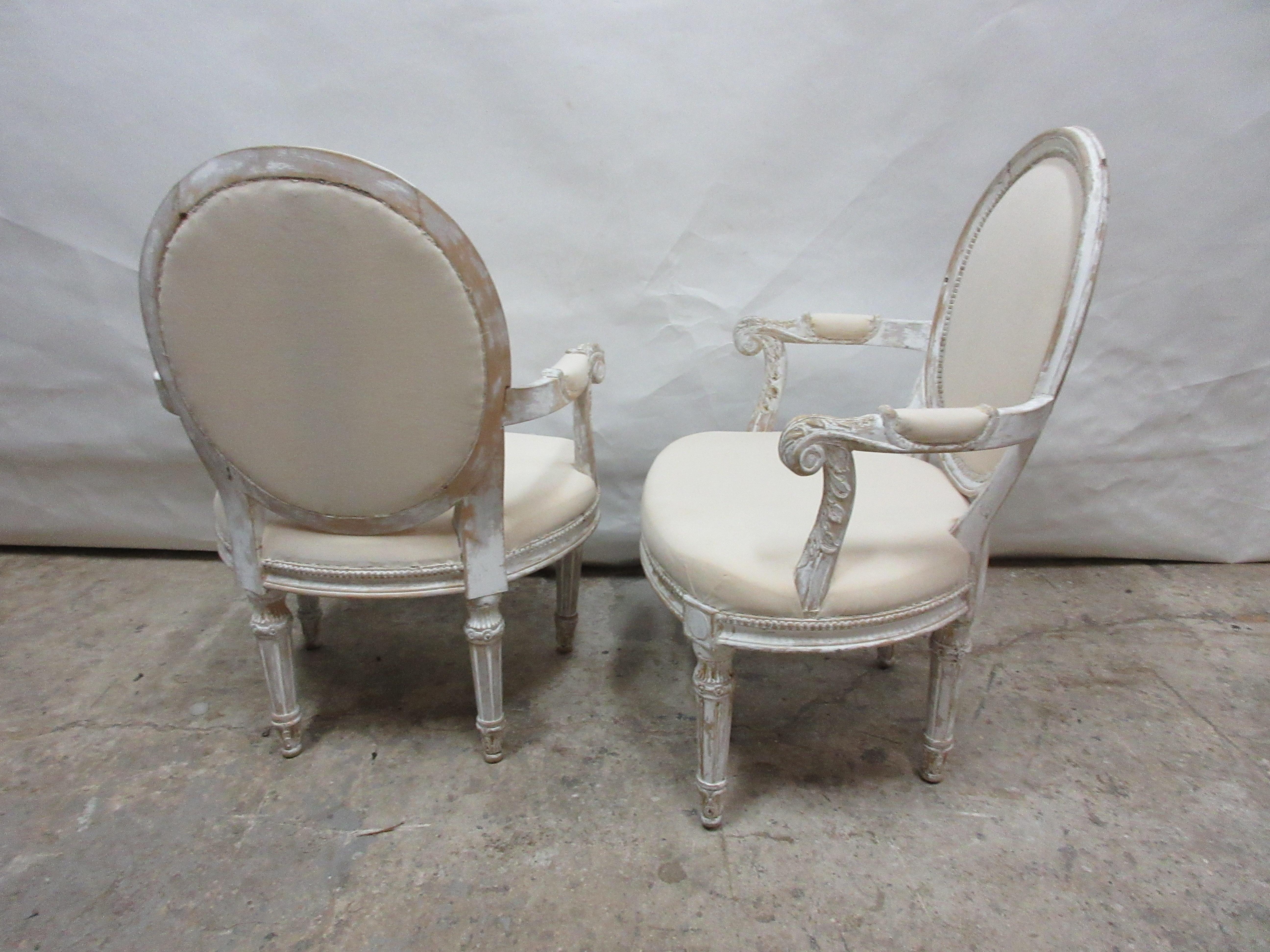 This is a set of 2 original painted Swedish Gustavian armchairs. The seating has been restored and covered in Muslin.
