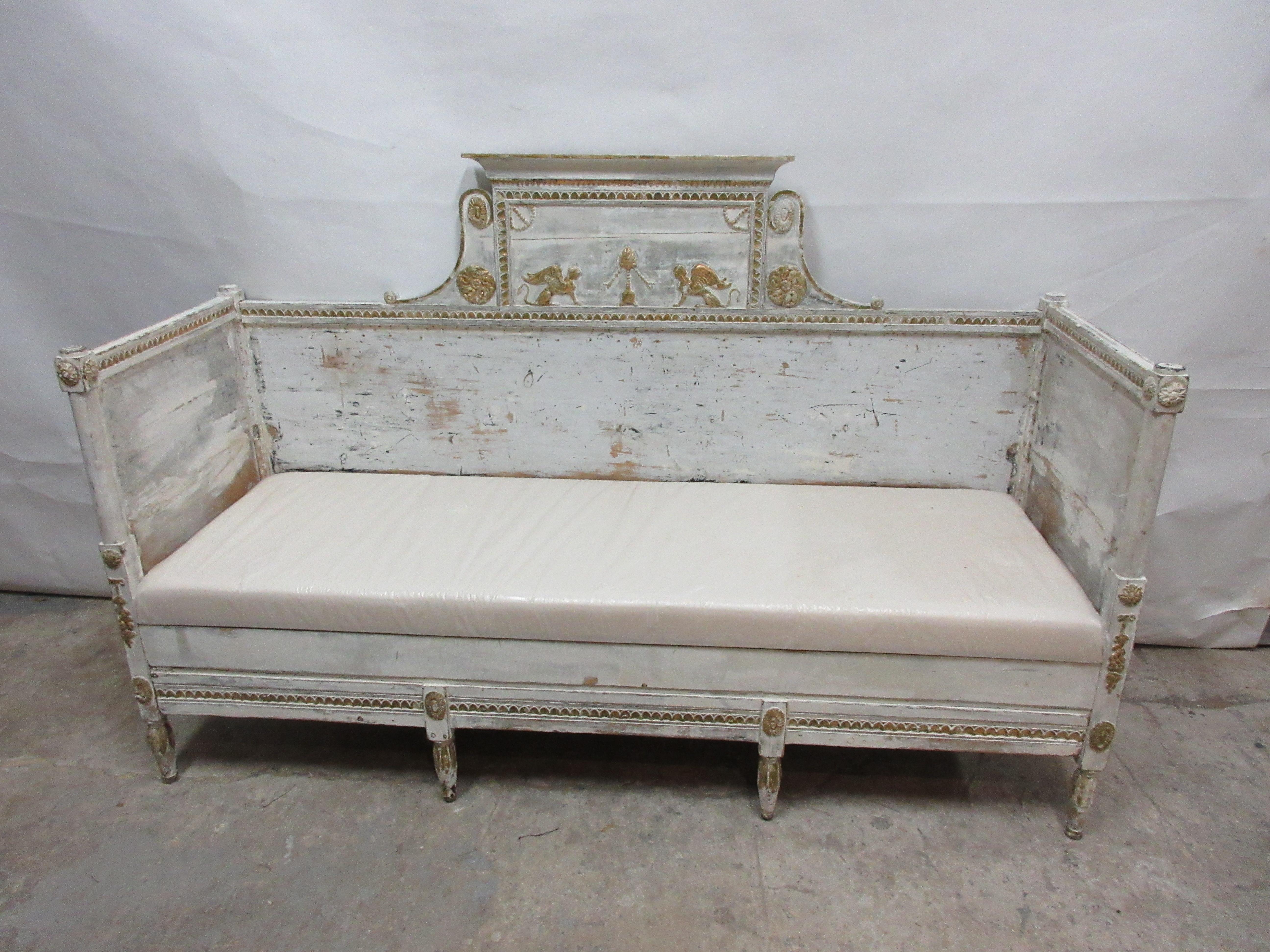 This is a 100% original painted Swedish Gustavian sofa. It has new cushion seating covered in Muslin. This sofa was found at an Auction in Stockholm, Sweden.