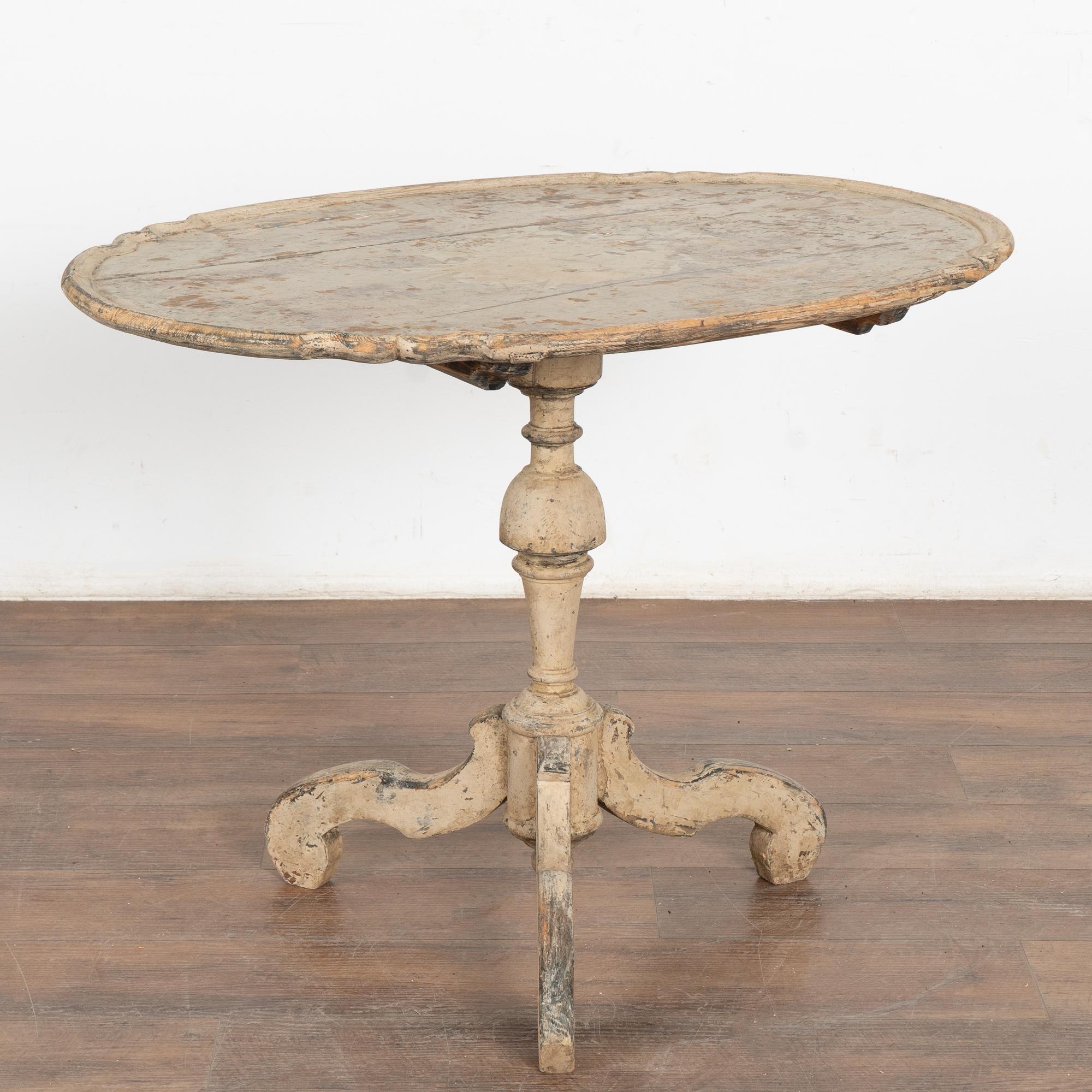 The aged patina of the pine adds to the attraction of the curves and grace of this Rococo tilt top pine table.
The original painted finish has a warm aged patina from generations of use, distressed throughout to reveal the natural pine wood below.