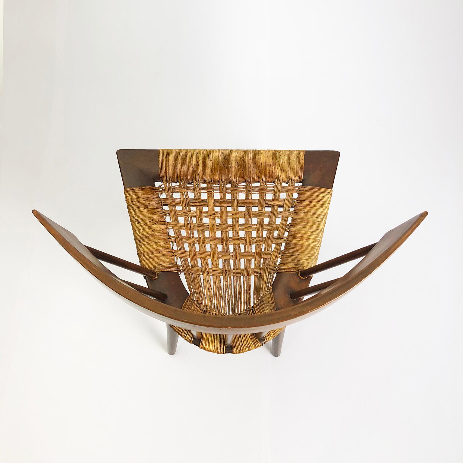 Original pair of Yucatan chairs designed by Edmund Spence for Industria Mueblera in Mexico, circa 1950s. The chairs feature a unique and hand sculpted Japanese-inspired interpretation of a traditional spindle back chair similar to George Nakashima’s