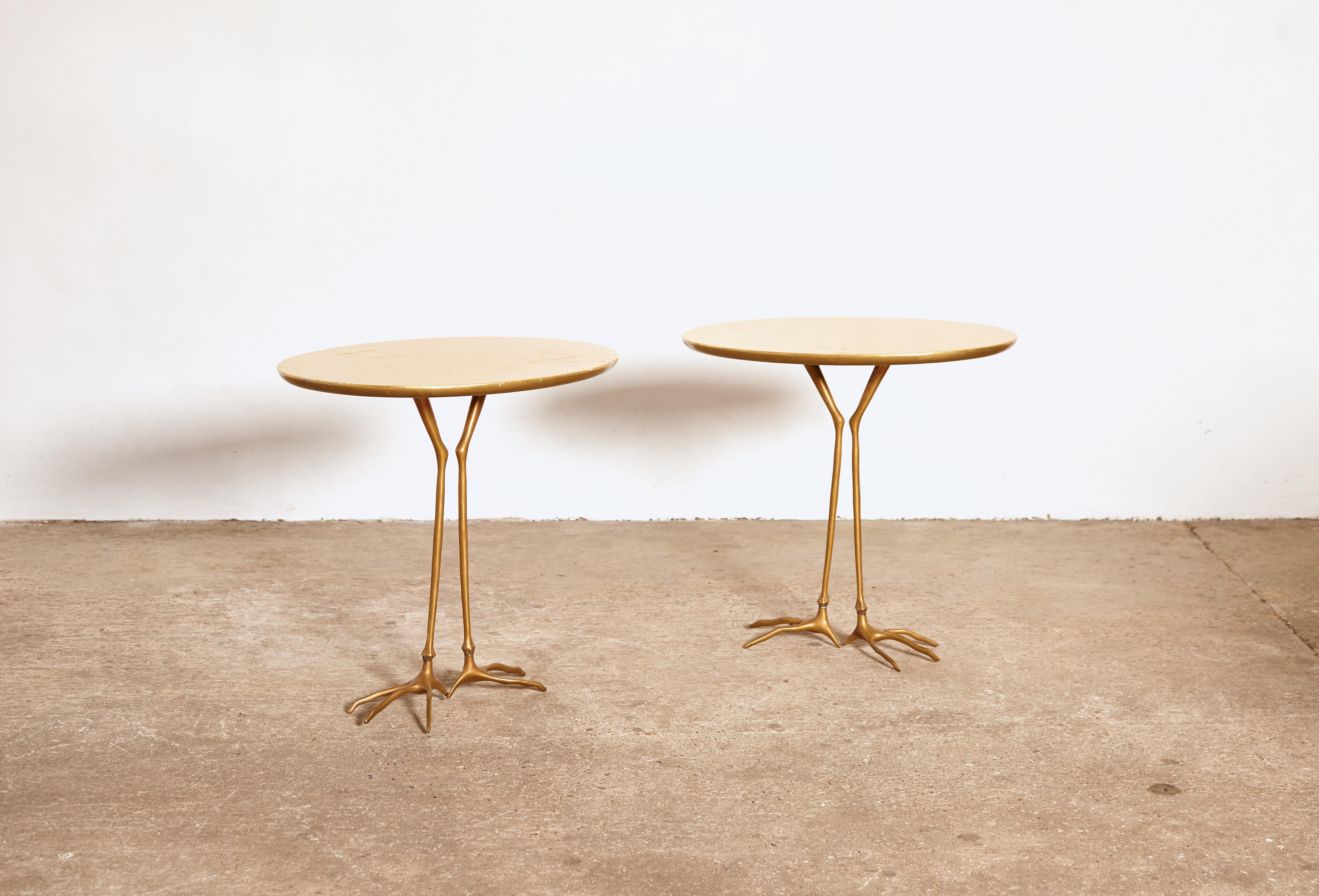 An original pair of 1970s Meret Oppenheim Traccia tables. This pair manufactured by Gavina, Italy in the 1970s. Oval shaped, original gold leaf top featuring bird footprints, on top of patinated cast bronze bird legs. Rarely found as an original