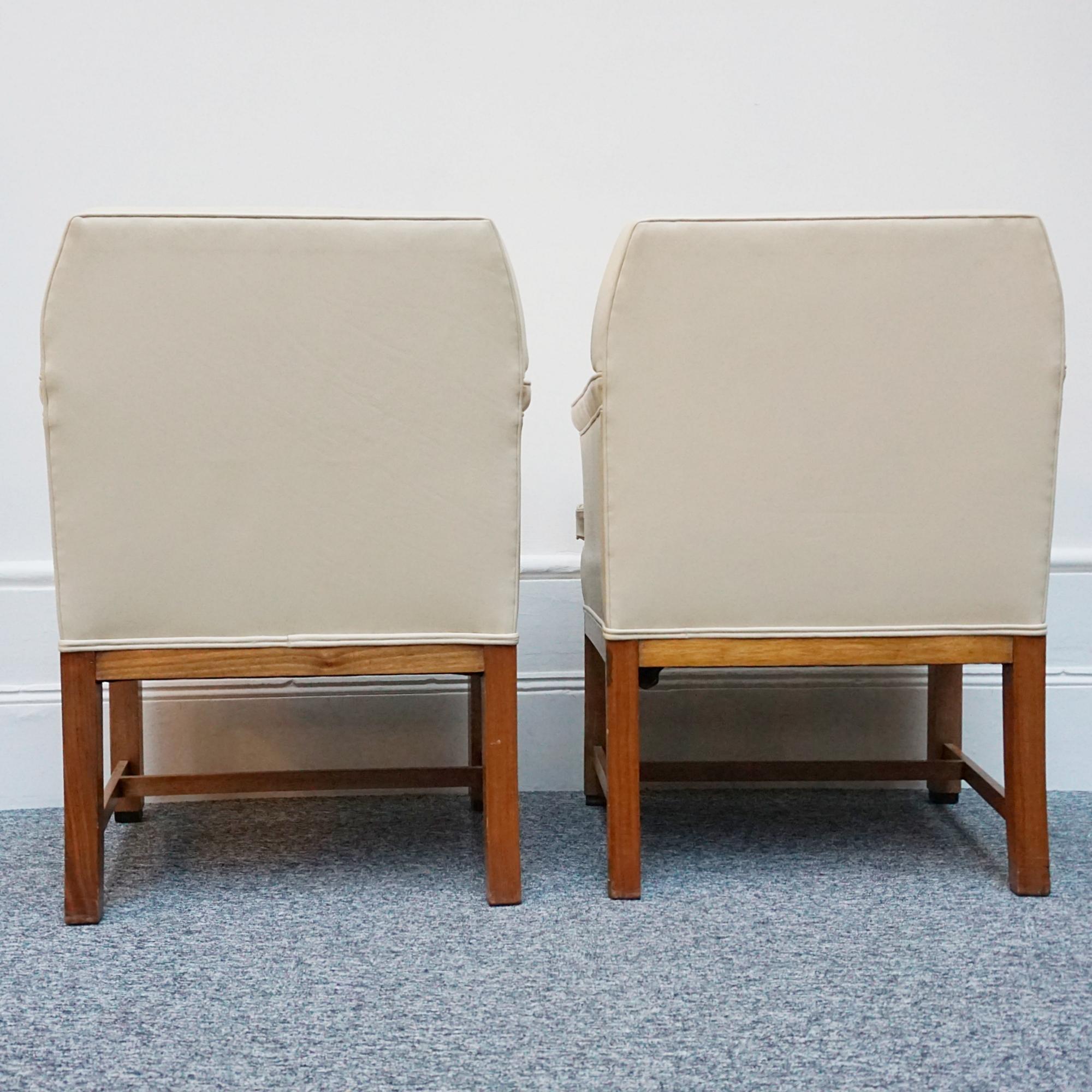 A pair of Art Deco armchairs. Cream leather upholstery with solid walnut frame and ebnonised pad feet.

Dimensions: H 88cm W 67cm D 65cm Seat H 53cm D 51cm W 50cm 