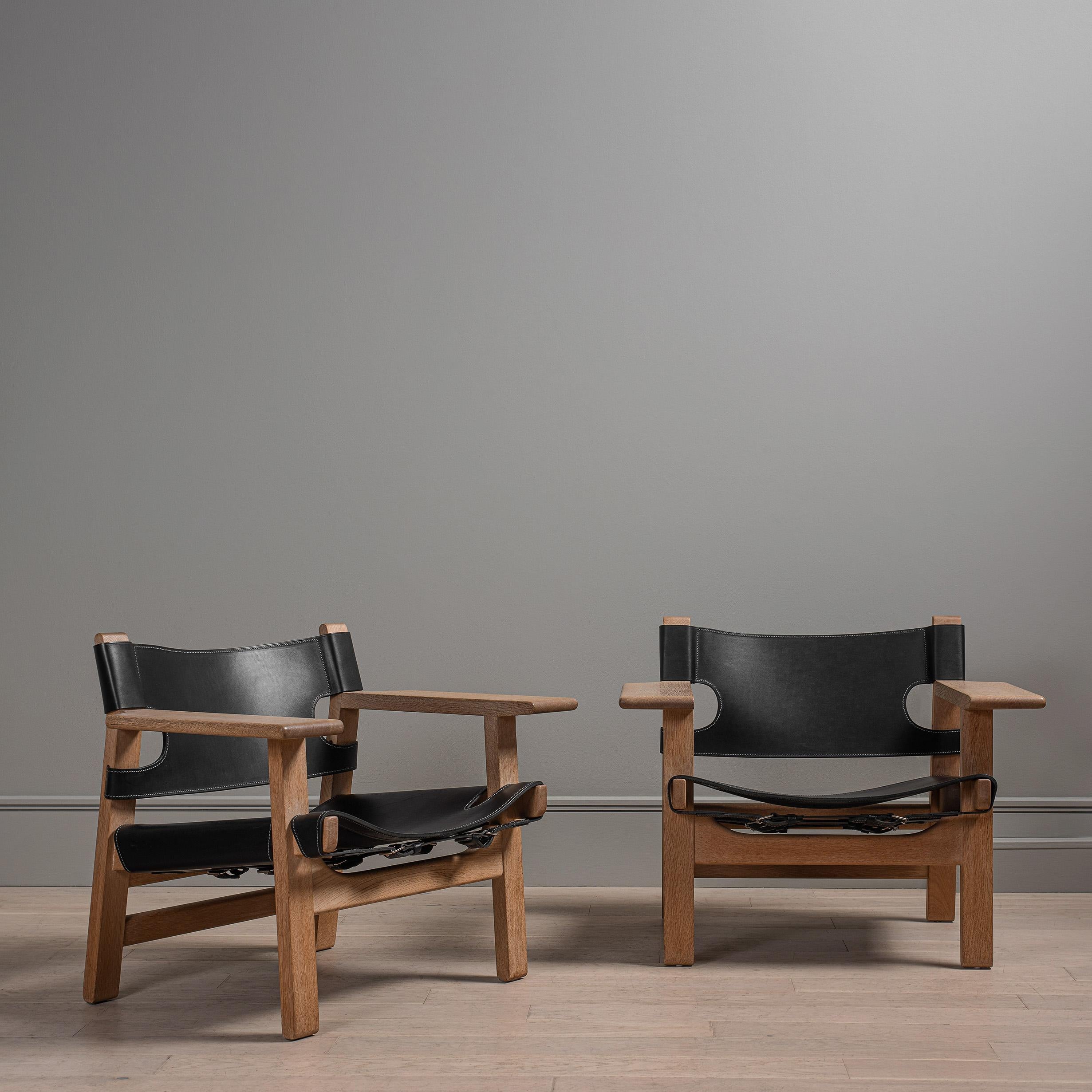A perfectly matching pair of the 'Spanish' chair by Borge Mogensen 1958, model 2226. One of his greatest and widely acclaimed designs. These are the earlier original versions from the Fredericia manufacturers, discernible by the frame construction.