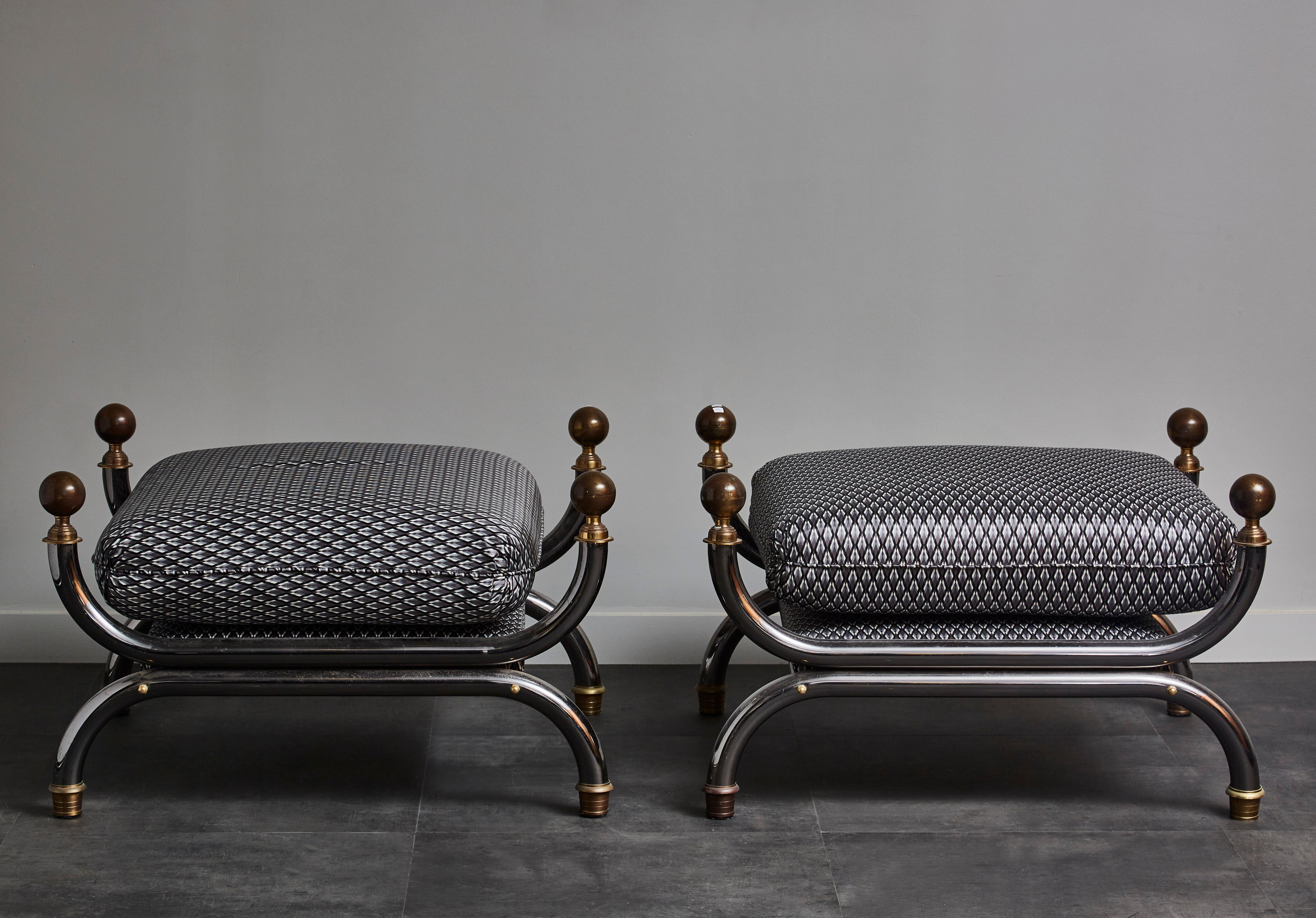 Pair of steel and patinated brass footstools, one cushion, fabric from Dedar Company.