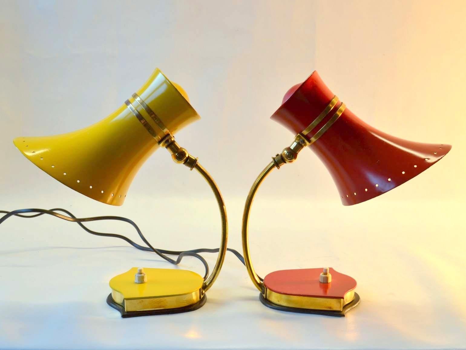 Pair of original Mid-Century Modern Italian red & yellow enameled aluminum & brass bell shape table lamps with adjustable joints to angle the light source. These Italian enameled sconces by Stilnovo were produced in the 1950s-1960s and are vintage