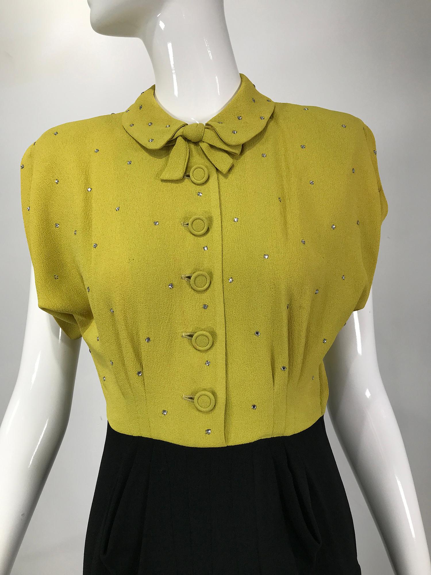 Original Paramount Junior Chicago 1940s chartreuse & black crepe dress with rhinestone bodice. The bodice of this amazing dress is sprinkled with small prong set rhinestones, it has notched cap sleeves, it closes at the front with self buttons and