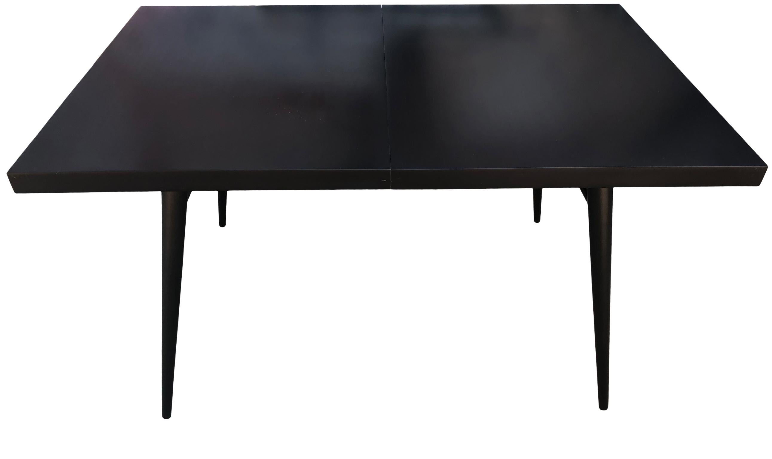Beautiful early 1950s Paul McCobb maple dining table. Great midcentury design. Totally refinished dining table #1522 with 4 tapered legs with dowel supports. All solid maple with fresh black lacquer finish in excellent condition. You are buying (1)