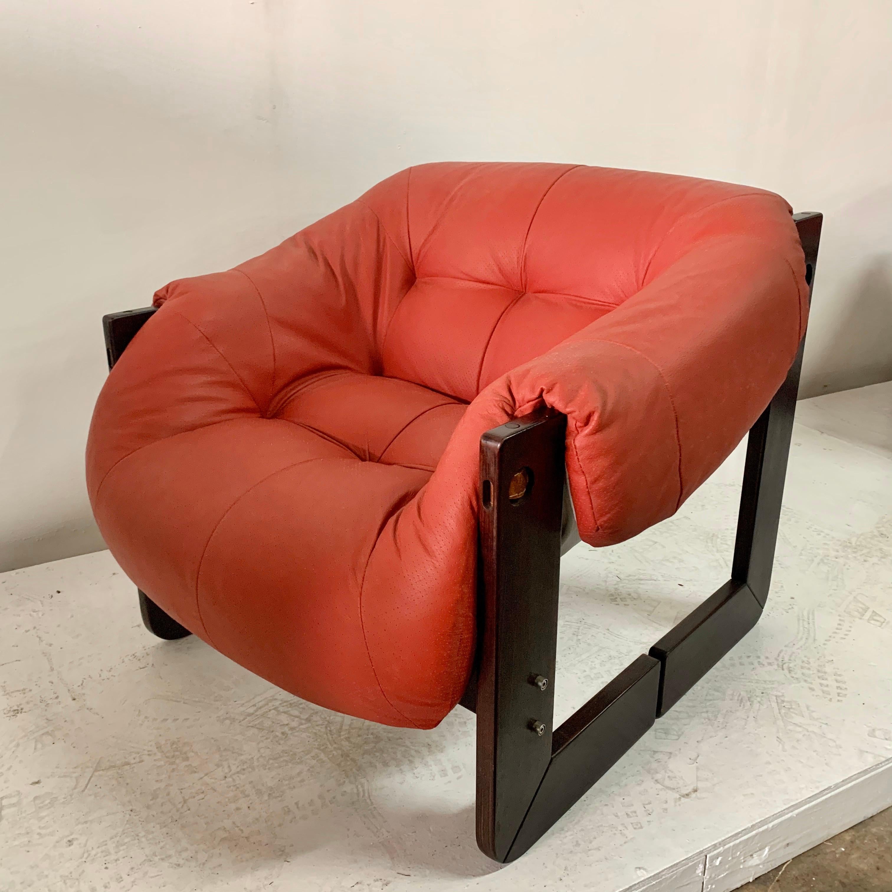 Mid-Century Modern lounge chair by Percival Lafer with Brazilian cherrywood and original vintage leather straps and dowels. Really unique design and construction make this a true statement piece. The split wood side pieces and the stitched leather