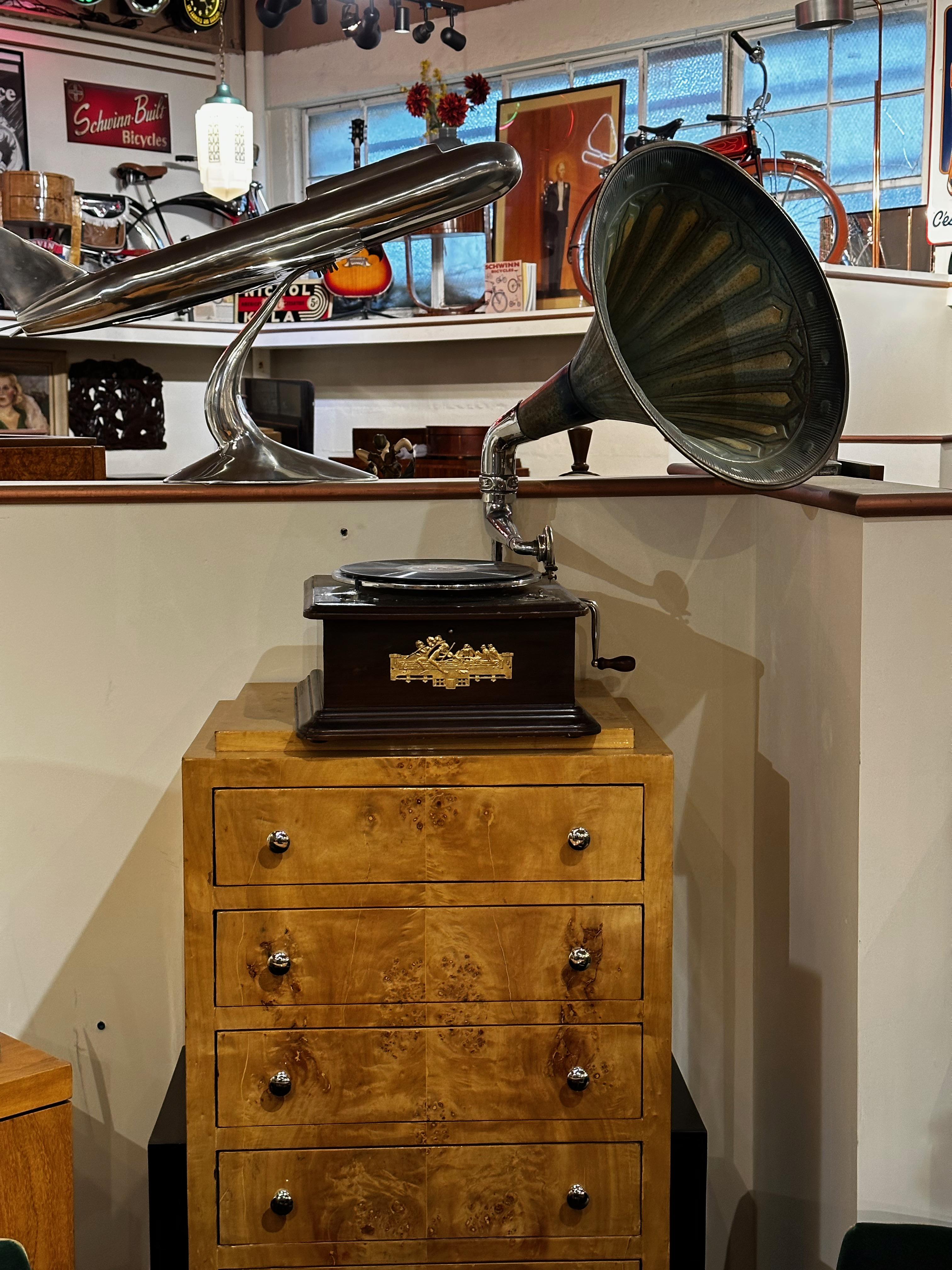 Original Phonograph Argentina With Horn Circa 1920. Great working photograph in very nice original condition with the most beautiful aged horn in a stunning patina. The sound is excellent. This is one of my favorite windup phonographs, the size is
