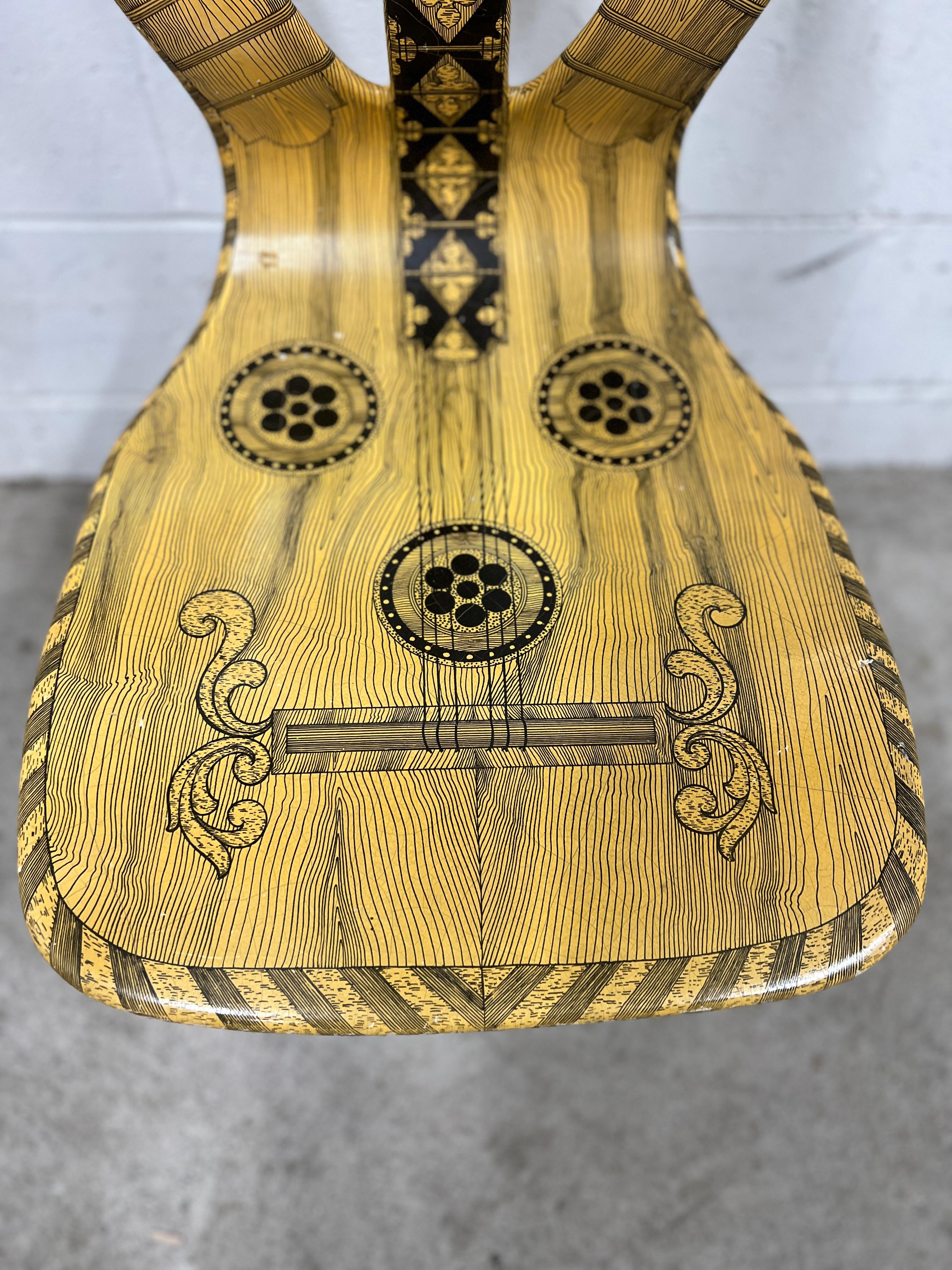 Piero Fornasetti (Italian, 1913-1988), circa 1960.

Musicale or Musical chair, produced by the esteemed Piero Fornasetti in Italy, during the early 1960s. While most of these chairs on the market are the reproductions produced in the 1990's, this is