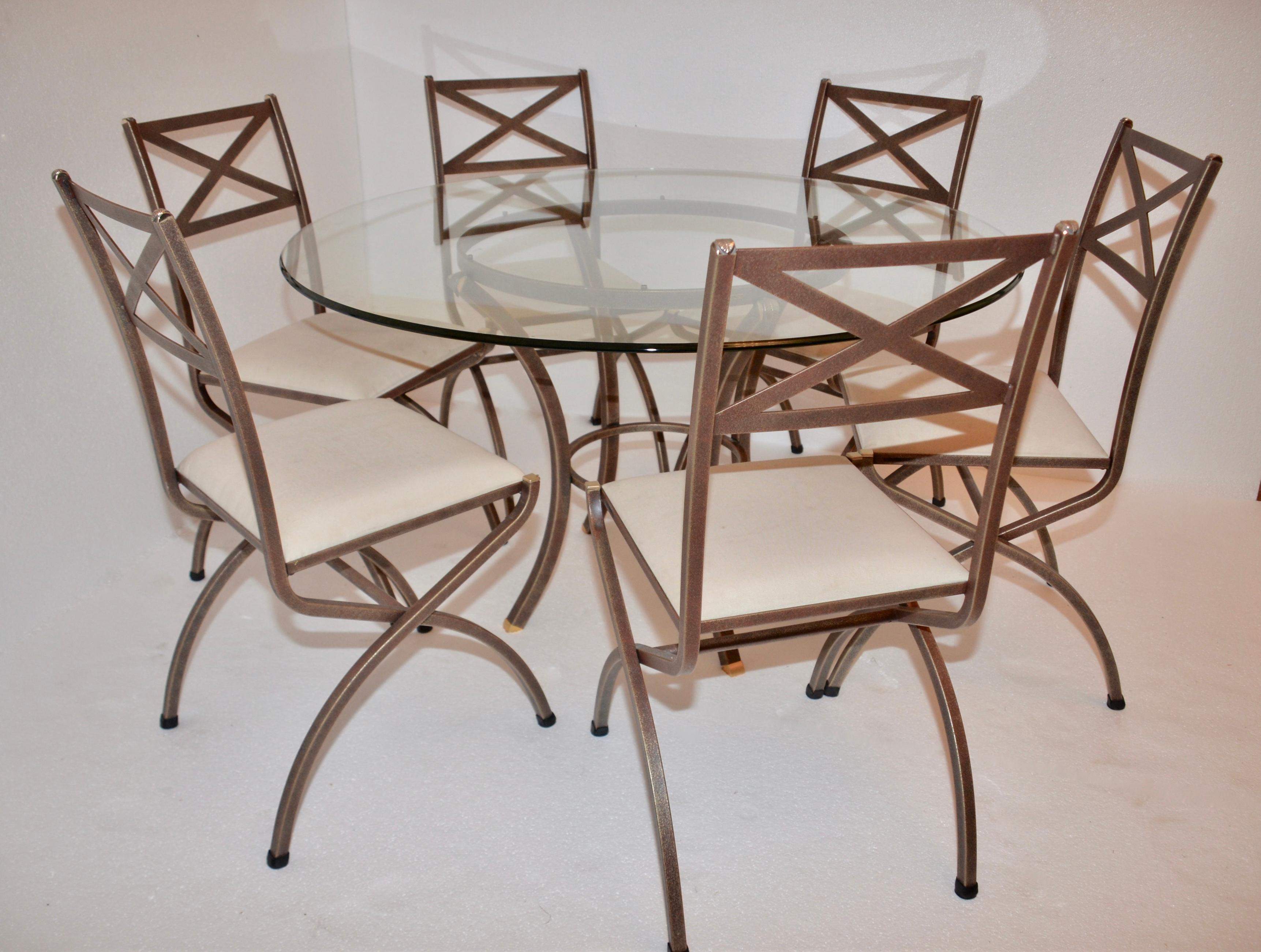 A genuine dining table and six chairs by the iconic French designer Pierre Vandel. This table has a beveled glass top the frame is brown with gold flecks. There are pretty brass leaf designs on the corner castings and on the top of each corner of