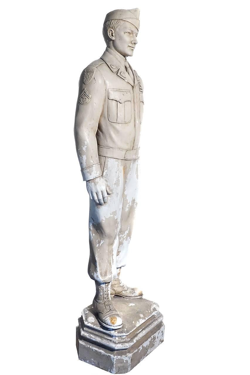 Other than the patch that reads airborne on the statue's shoulder with a parachute there is no other markings or signatures. It stands an impressive 42 inches and is very well done. The condition is excellent with a nice aged patina. We have not