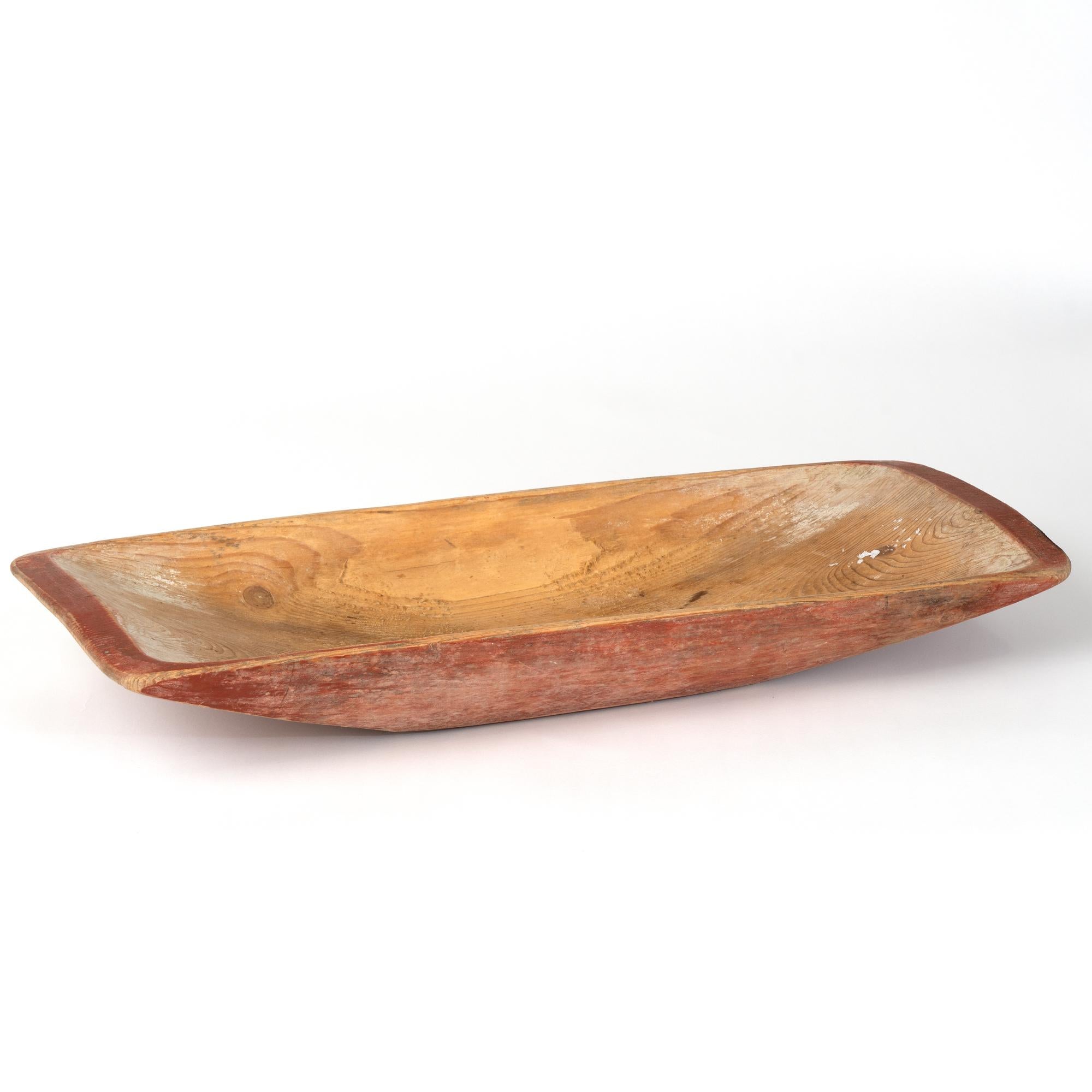 Original Swedish Folk Art carved pine wooden bowl with original red paint and warm patina. These bowls were used throughout families and often passed down generation to next generation. This bowl remains a highly functional item and now serve as a