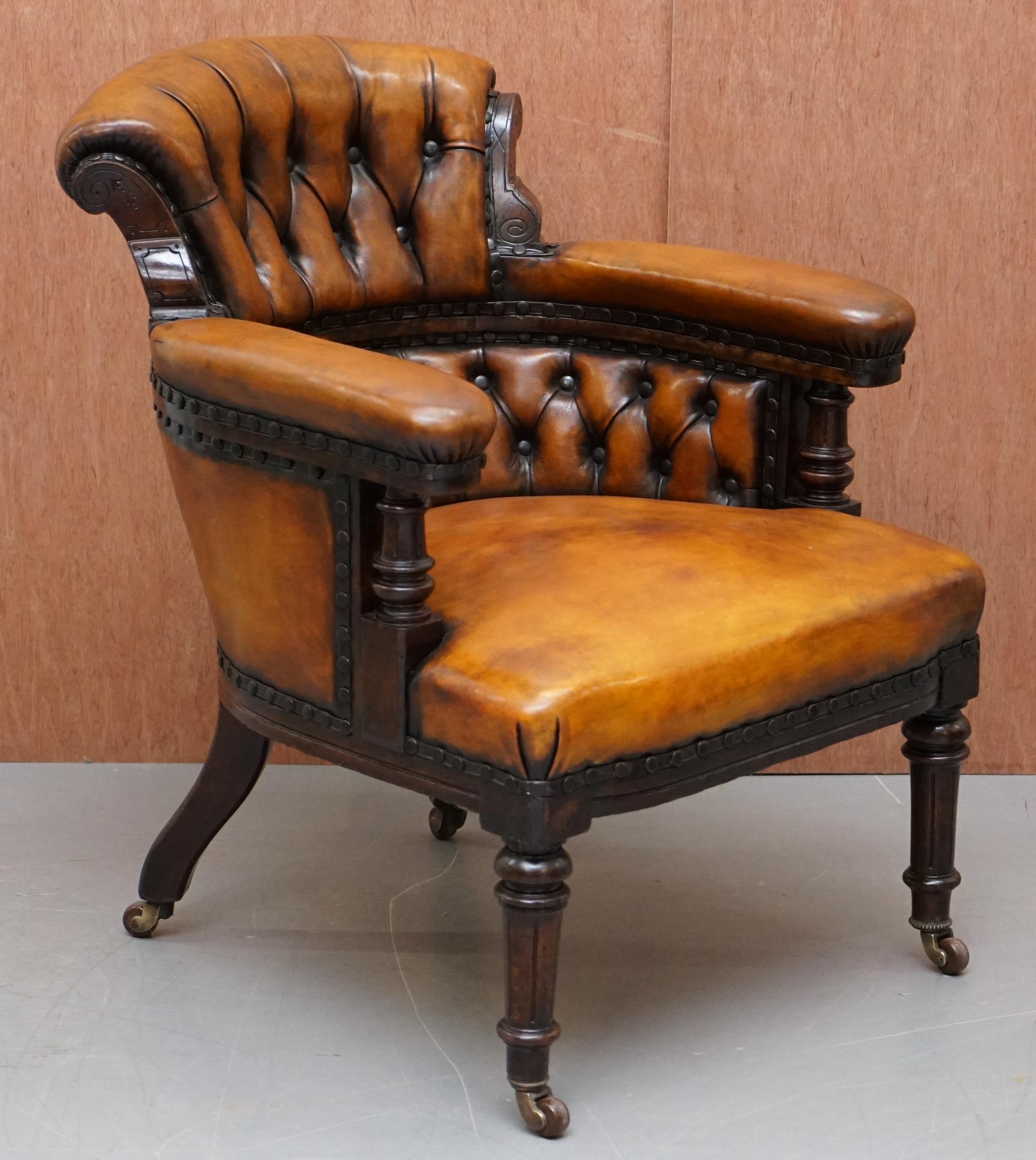 We are delighted to offer for sale this stunning and exceptionally rare original Regency circa 1810 hand carved mahogany framed brown leather Chesterfield oversized office library armchair

This chair is more than a bit special, I have never seen