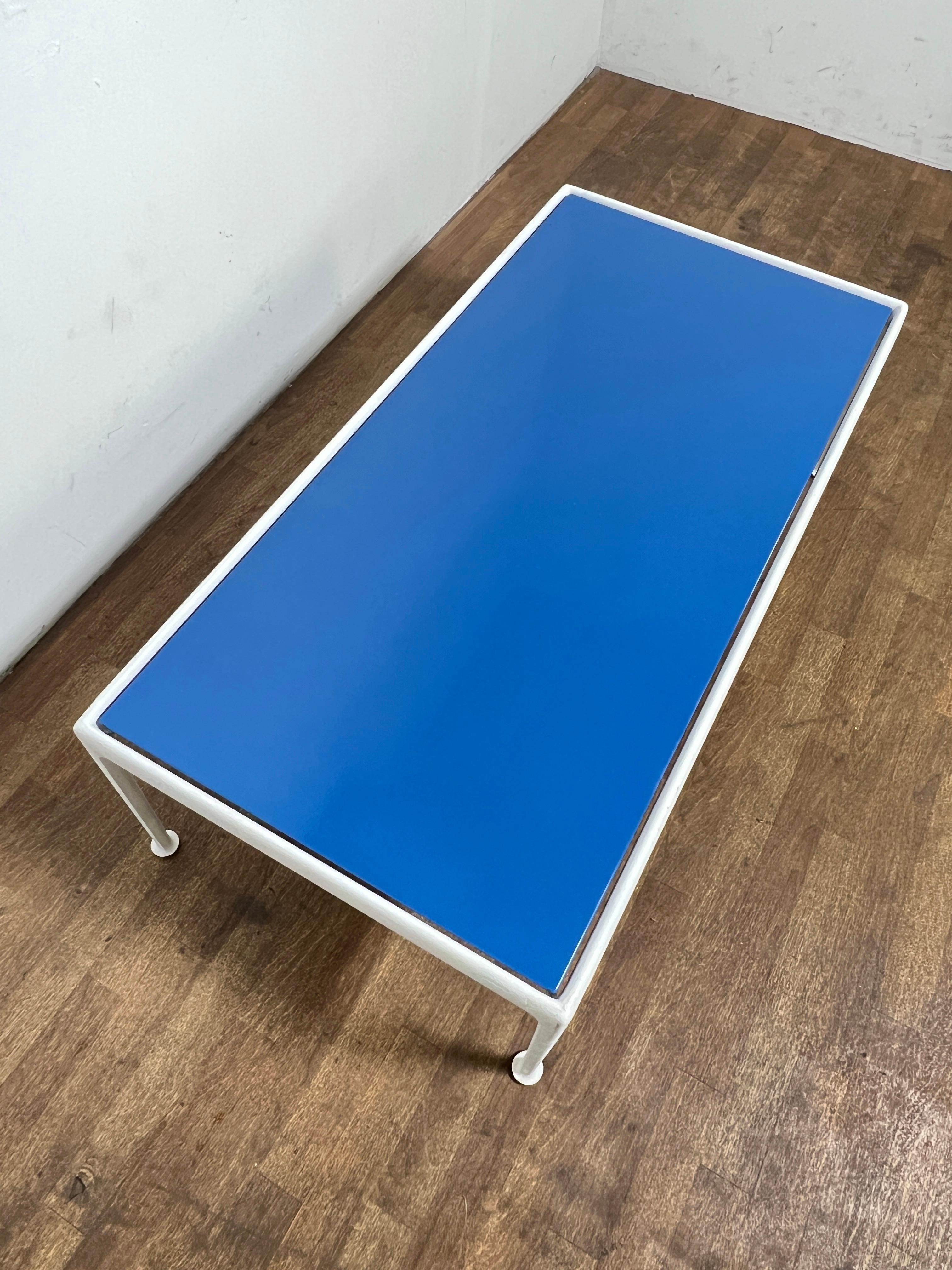 An outdoor coffee table with blue enamel top from Richard Schultz’s 1966 aluminum Leisure Collection for Knoll, 