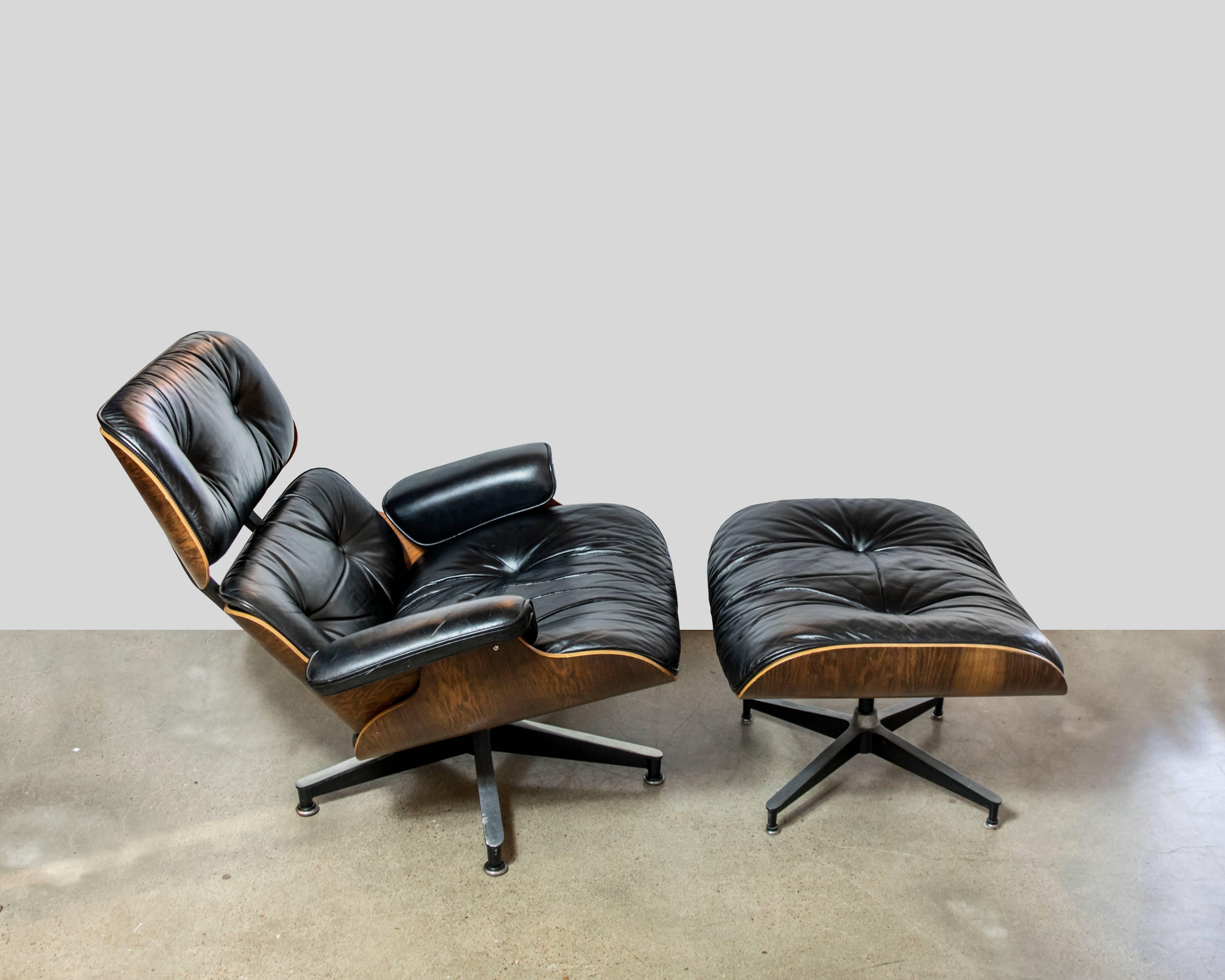 A much coveted original rosewood and black leather vintage Eames chair by Herman Miller from the 1970s. As these chairs age throughout the years, they need rubber bumpers / shocks which are easily available and found on Ebay or Herman Miller.