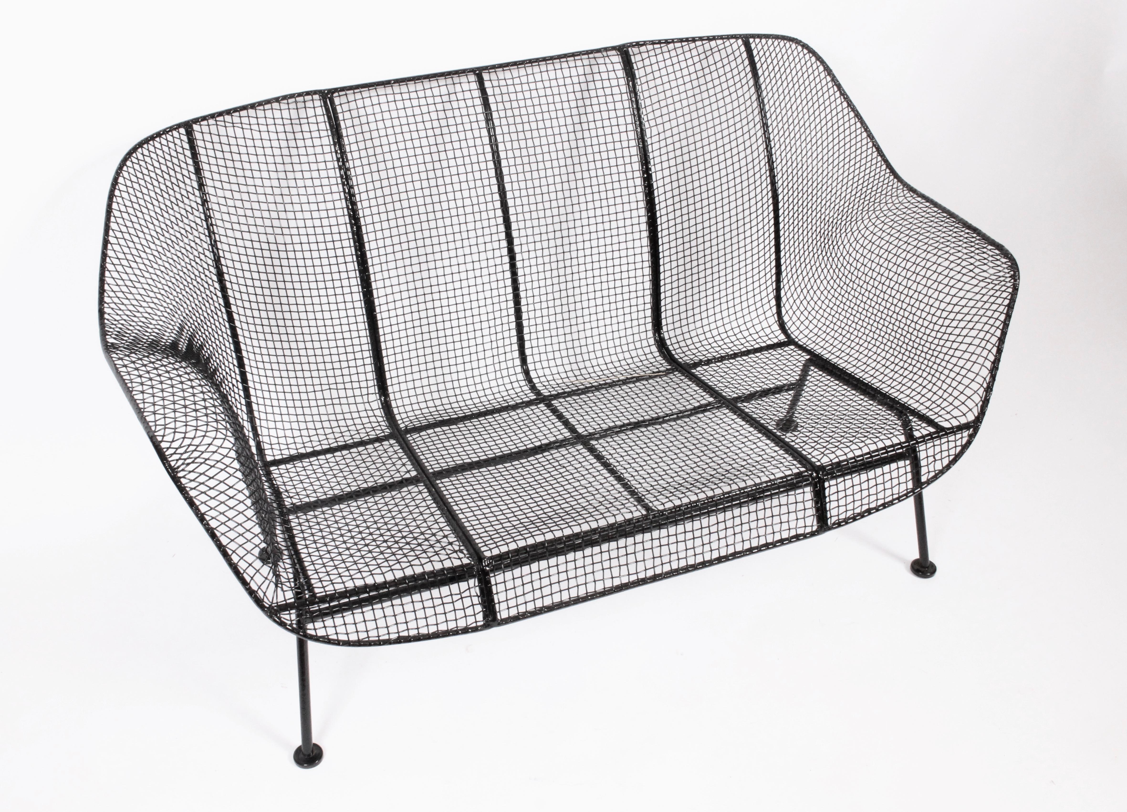 Classic and early Russell Woodard black Sculptura loveseat from the 1950's. Comfortable.  Relaxed. Indoor Outdoor seating. Professionally sandblasted and painted in high gloss Black enamel paint. 