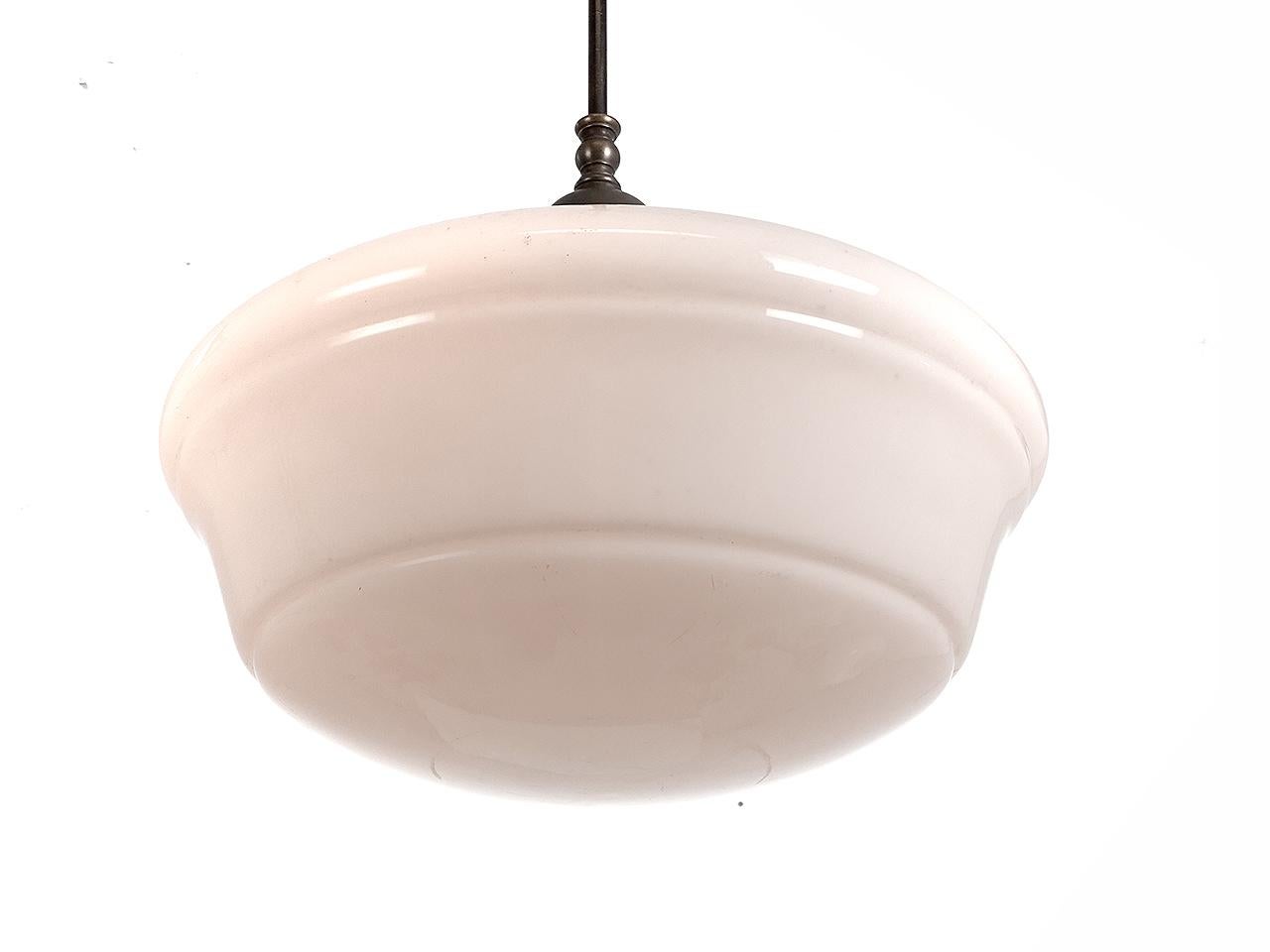 The 14 inch milk glass shade and brass holder are all original. The look is Classic. Only one in stock.