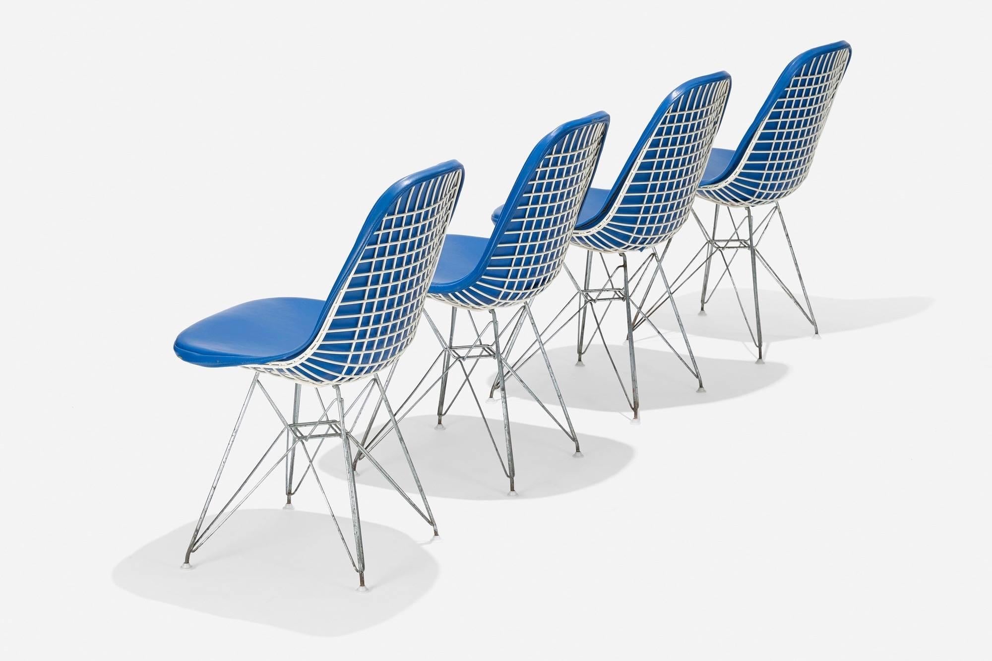 Charles (1907- 1978) and Ray Eames (1912-1988)

An early set of four imaginative DKR-1 chairs by Charles and Ray Eames for Herman Miller. In white powder coated and chromed steel, with original blue vinyl seats raised on iconic Eiffel legs. These