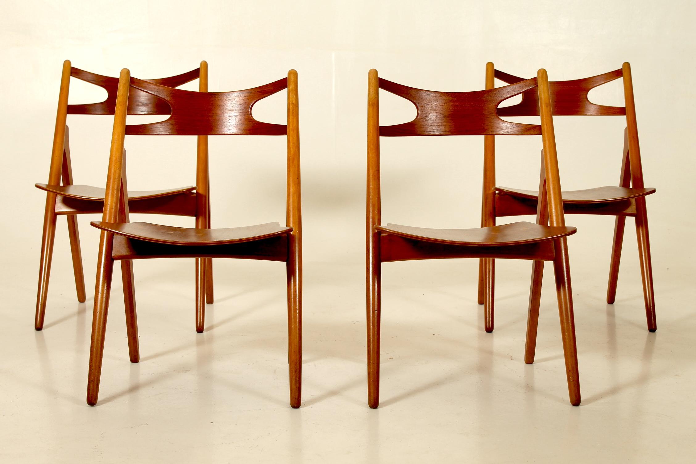 Amazing set of four sawback, teak and oak plywood side chairs, model CH29. Designed in the 1950s by Hans Wegner and manufactured by Carl Hansen and son, Denmark.
