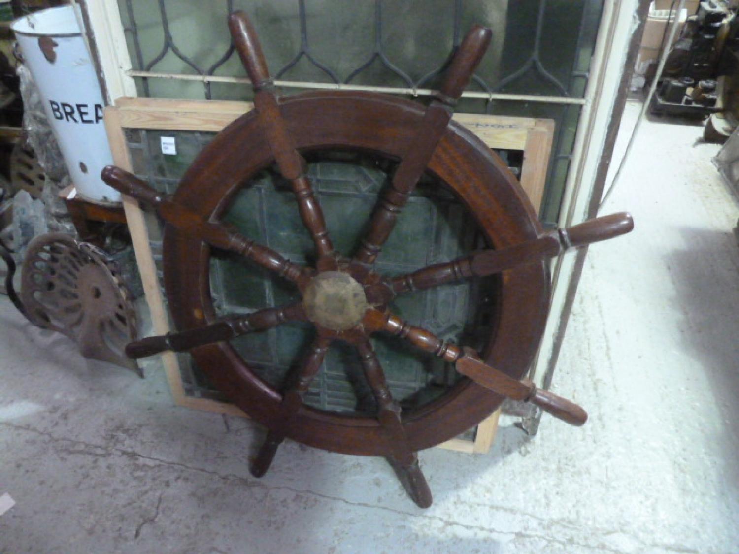 Nice example of nautical/maritime history... original ship wheel with eight turned spokes, shaped handles and brass hub with inset brass banding.