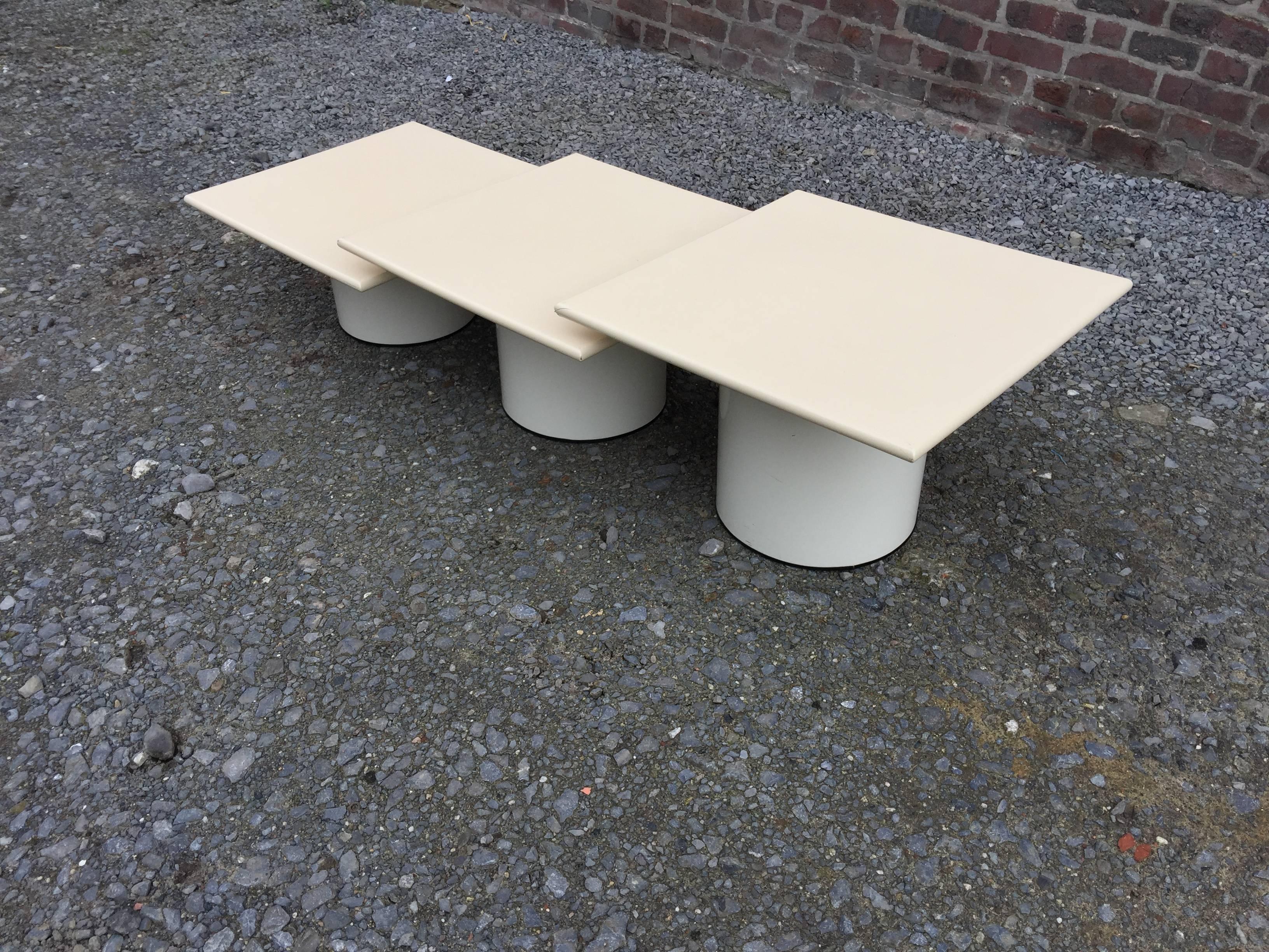 Original side tables or nesting tables in metal and lacquered wood, circa 1970.