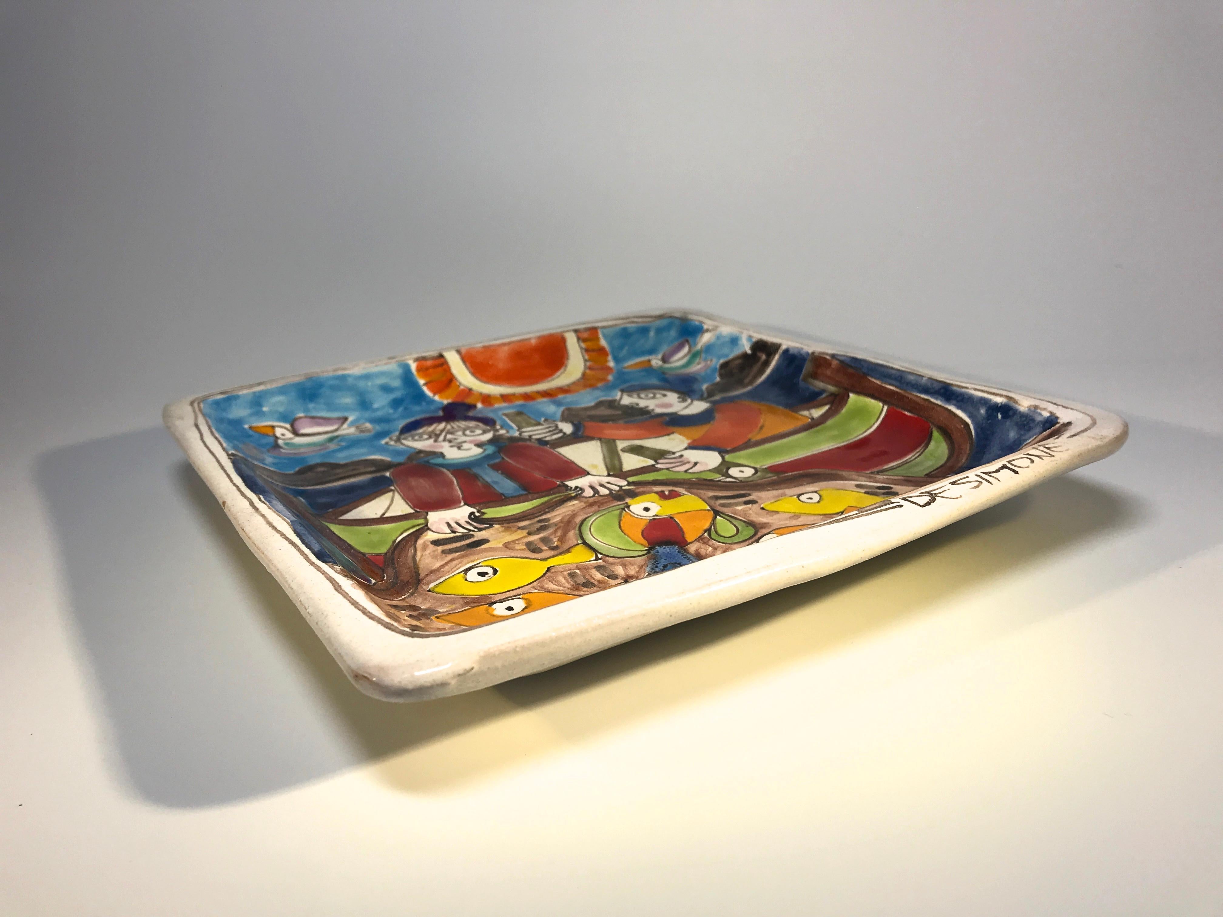 Original and signed by Giovanni DeSimone, this hand painted ceramic dish of 'Two Fishermen' is full of color and vibrancy - typical of Giovanni's work,
'Two Fishermen' is a fun piece and testament to Giovanni's humour and creativeness
Signed to
