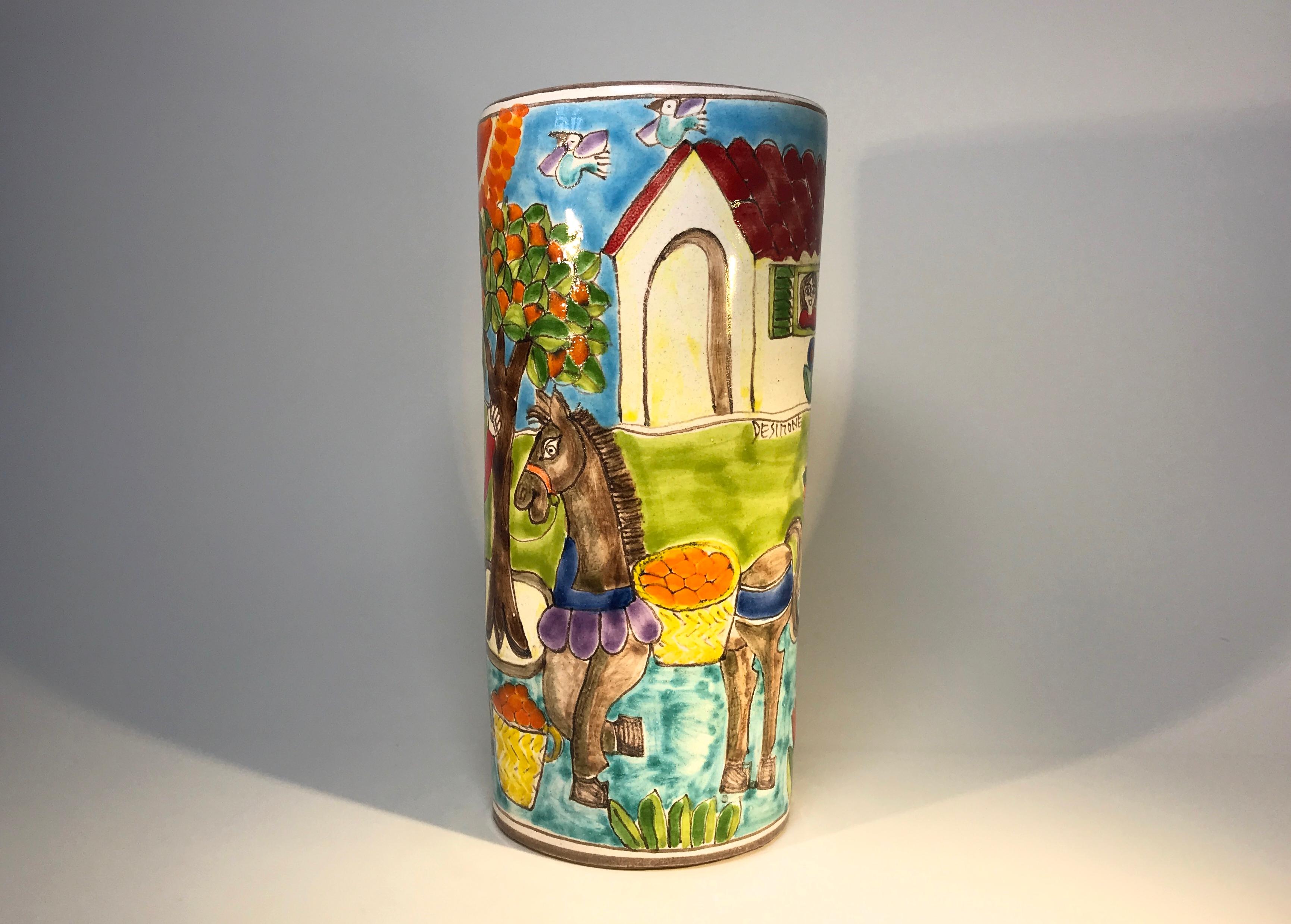 Original and signed by Giovanni DeSimone, this hand painted vase is full of vibrant colors depicting 'Italian Village Life'
A fabulous and fun piece demonstrating Giovanni's creativeness and wonderful sense of humour
Signed to front by Giovanni