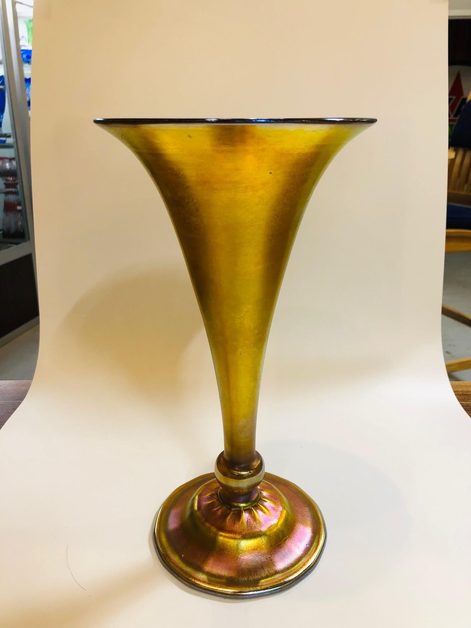 Original signed Louis Comfort Tiffany Trumpet vase 6292 art glass vase in great condition mid 20th century. This is a gorgeous Art Nouveau L.C. Tiffany trumpet vase it has many beautiful colors. The colors of this trumpet vase resemble a majestic