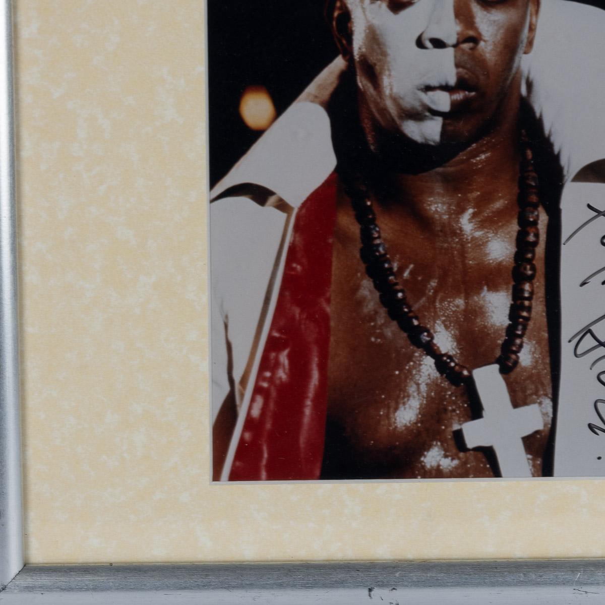 A rare signed photograph by Geoffrey Holder & miniature movie posters. Geoffrey Holder portrayed the charismatic and enigmatic Baron Samedi in the James Bond film 